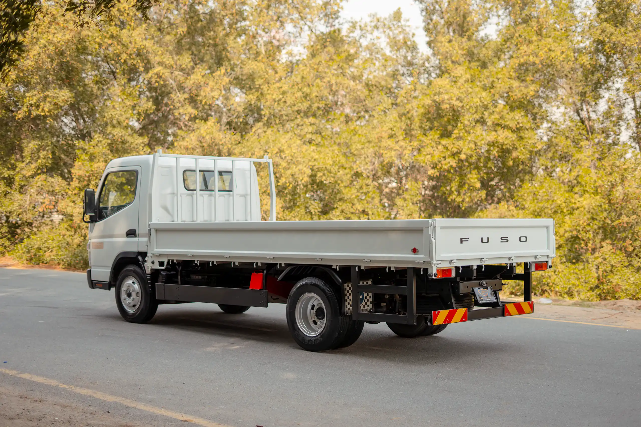 Used 2017 Mitsubishi Canter Cargo Body White – Left Back Diagonal (45°) View at First Choice Cars Sharjah