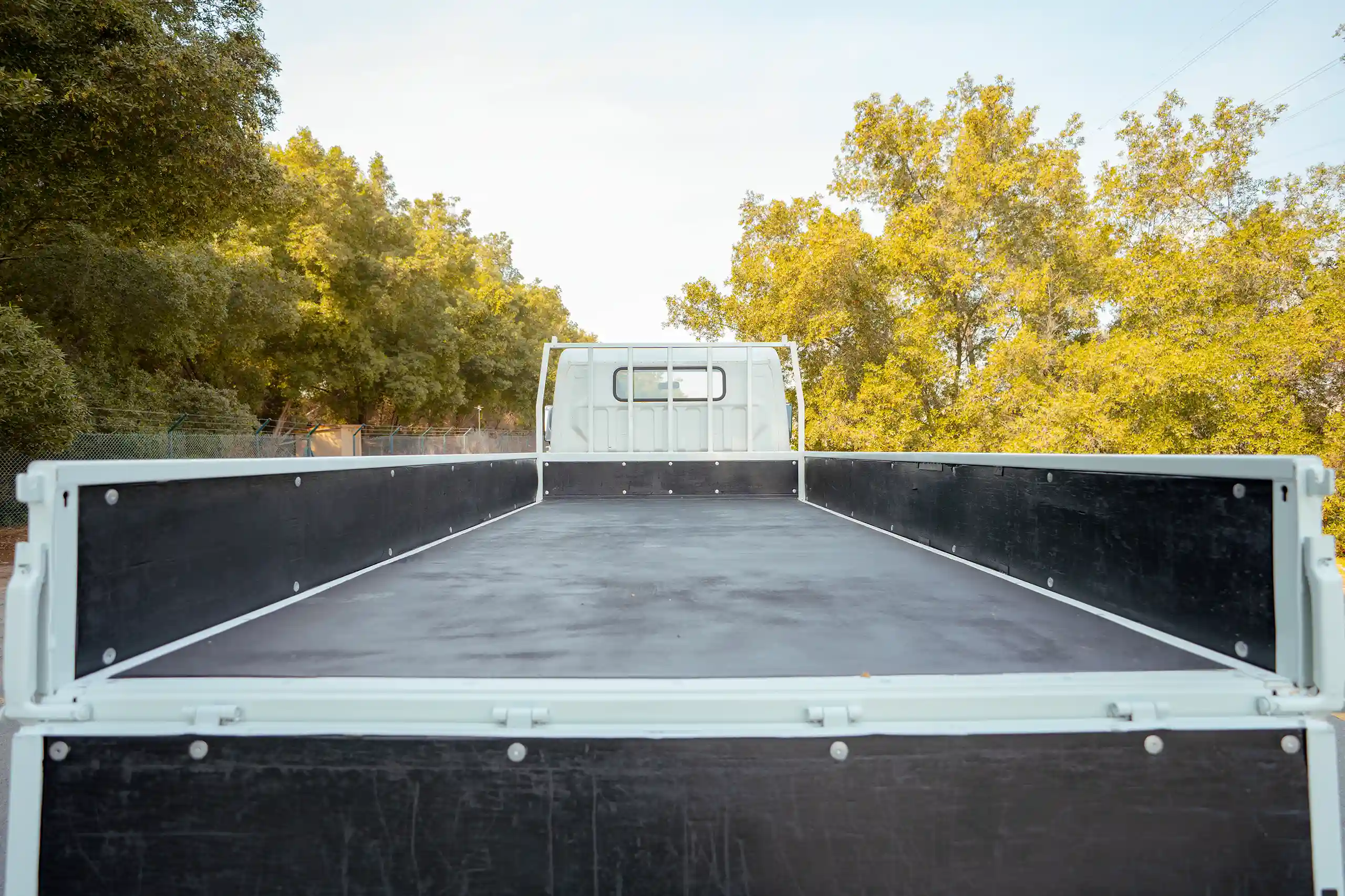 Used 2017 Mitsubishi Canter Cargo Body White – Cargo Bed Rear-to-Front View at First Choice Cars Sharjah