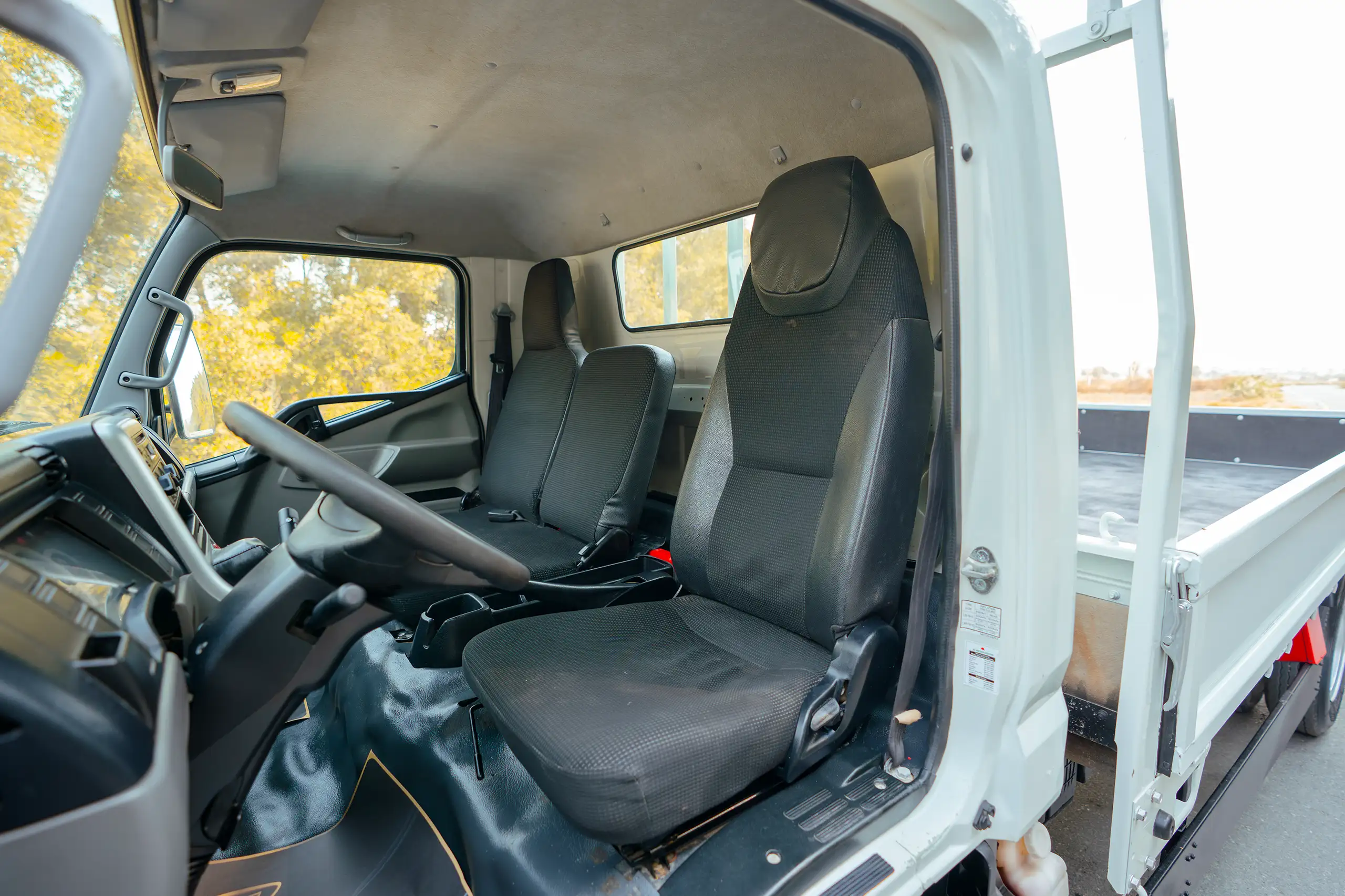 Used 2017 Mitsubishi Canter Cargo Body White – Front Driver Side Cabin View at First Choice Cars Sharjah