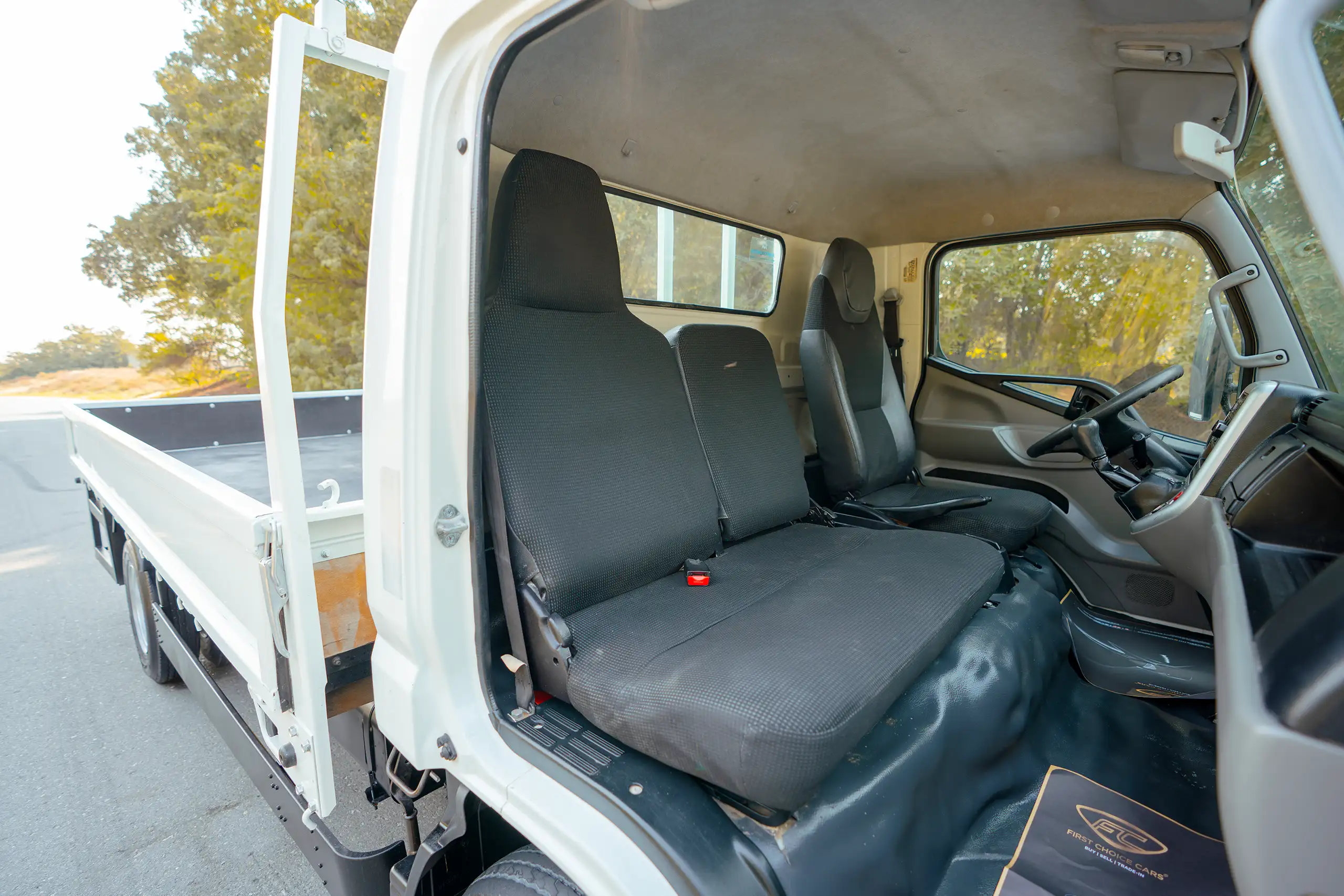 Used 2017 Mitsubishi Canter Cargo Body White – Front Passenger Side Cabin View at First Choice Cars Sharjah