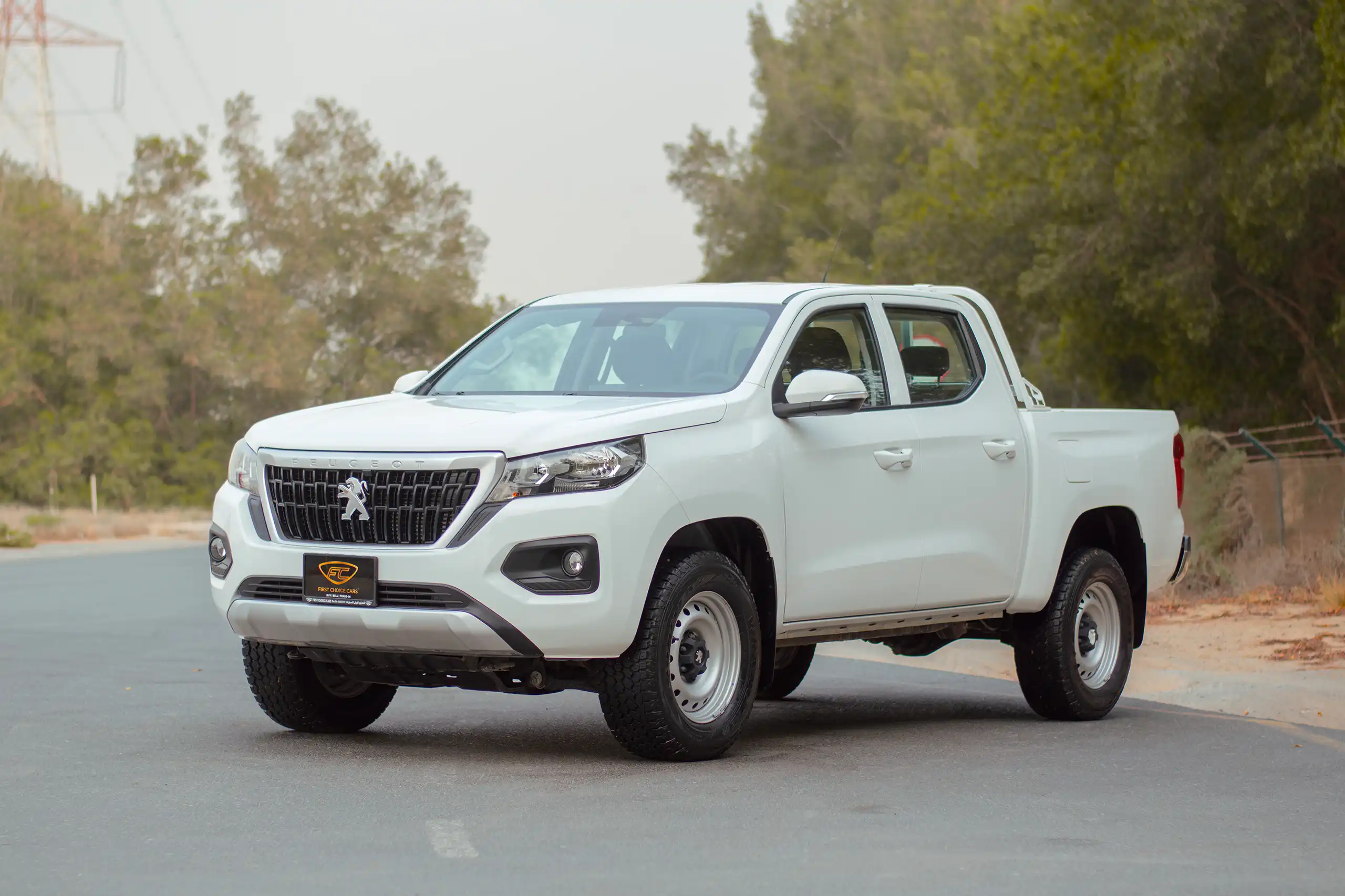 Used 2023 Peugeot Landtrek Double Cabin White – Left Front Diagonal (45°) View at First Choice Cars Sharjah