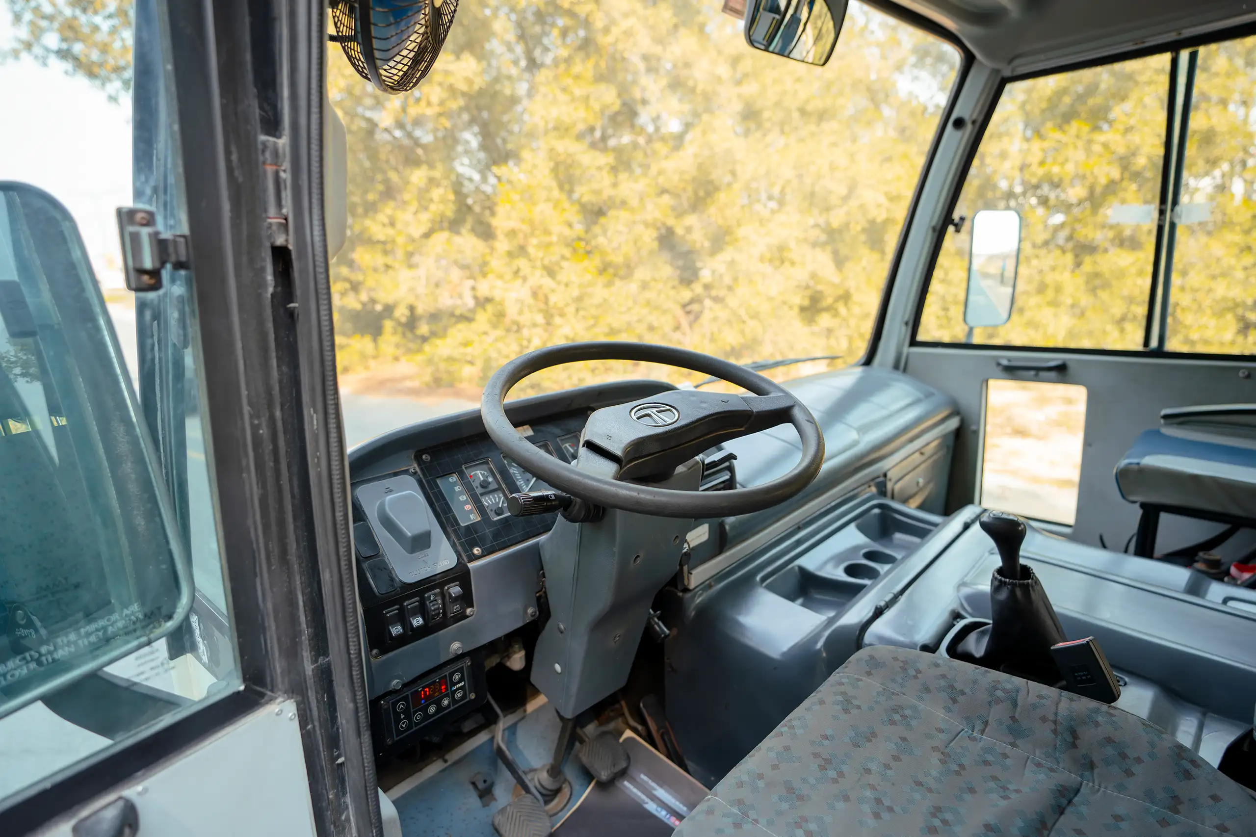 Used 2017 TATA LP 613 White – Driver Side Dashboard & Steering View at First Choice Cars Sharjah