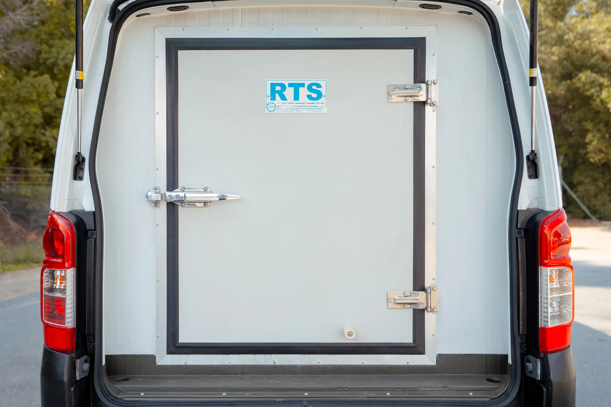 Used 2020 Nissan Urvan Standard Roof in White – Rear – Airtight Freezer Door – Straight Rear View for Sale at First Choice Cars Dubai Sharjah