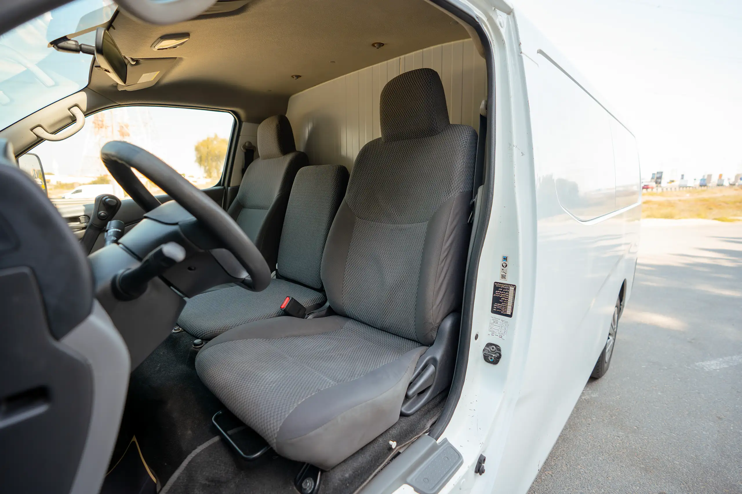 Used 2020 Nissan Urvan Standard Roof in White – Front Driver Side Cabin View for Sale at First Choice Cars Dubai Sharjah