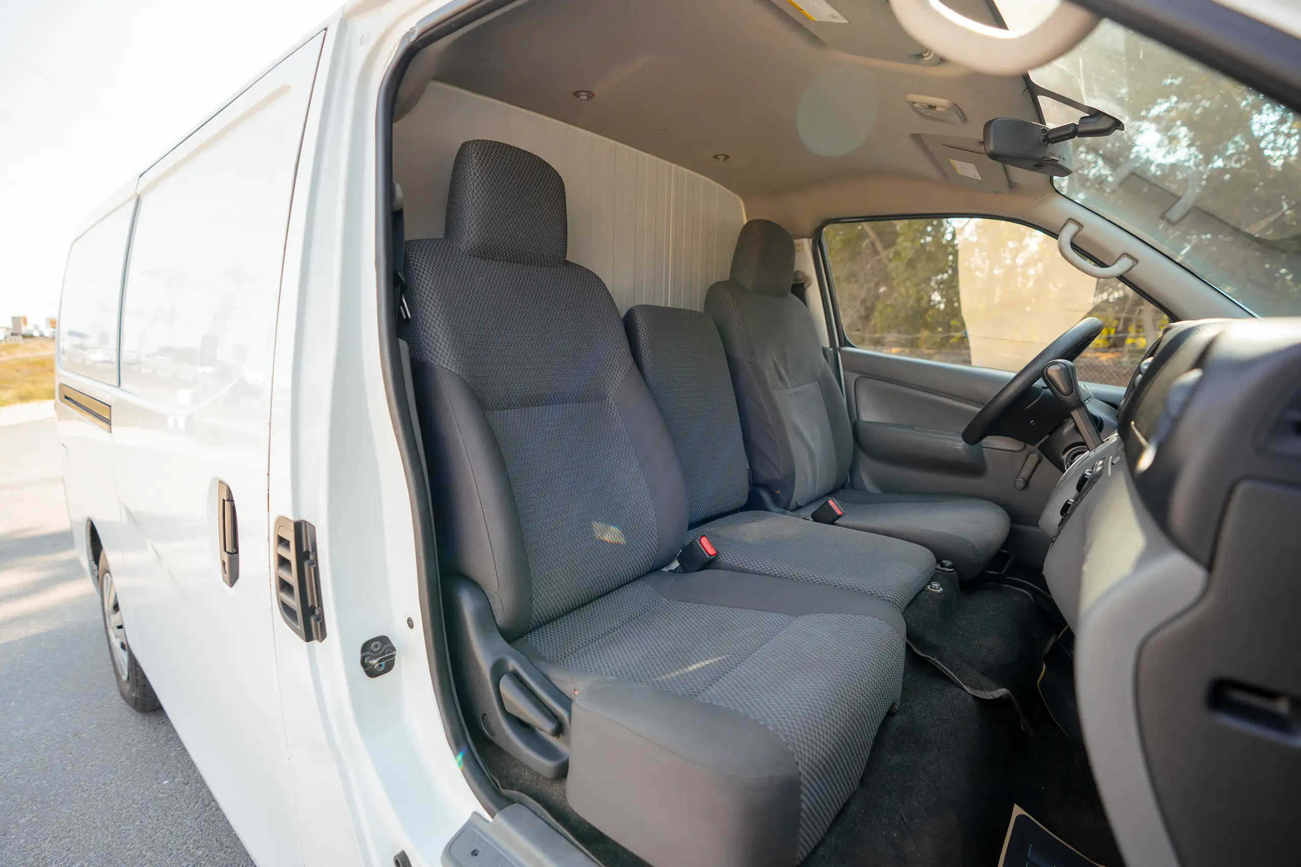 Used 2020 Nissan Urvan Standard Roof in White – Front Passenger Side Cabin View for Sale at First Choice Cars Dubai Sharjah