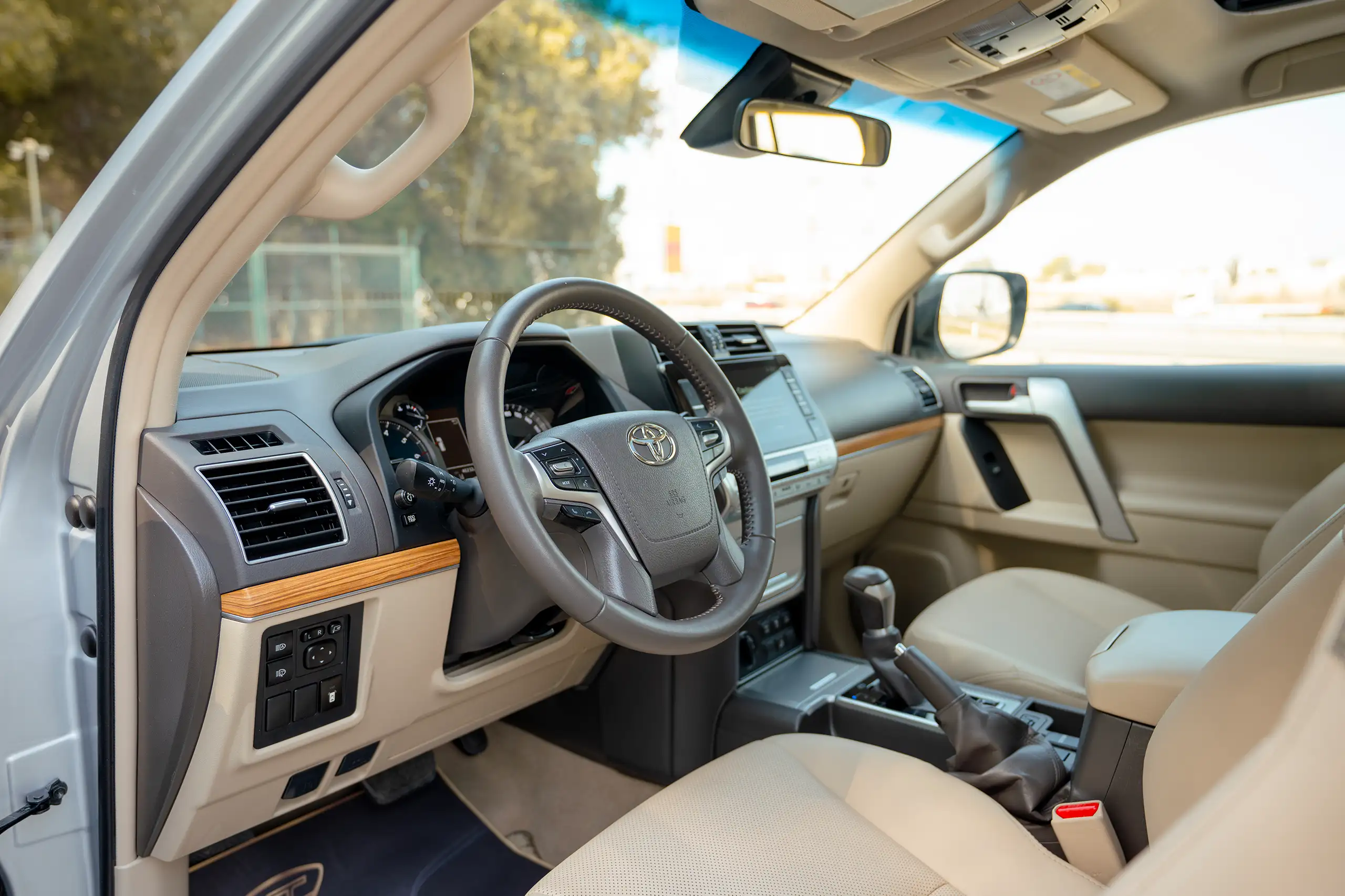 Used 2023 Toyota Prado VXR Silver – Driver Side Dashboard & Steering View at First Choice Cars Sharjah