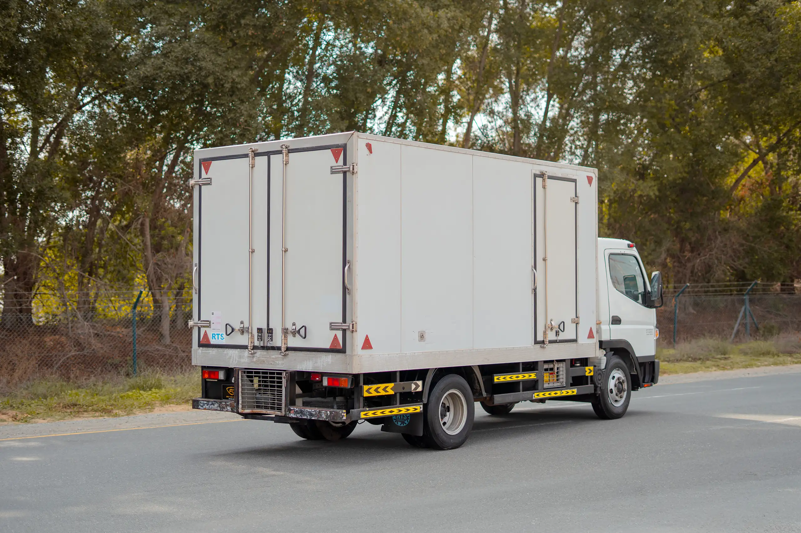 Used 2020 Mitsubishi Canter Chiller Box White – Right Back Diagonal (45°) View at First Choice Cars Sharjah