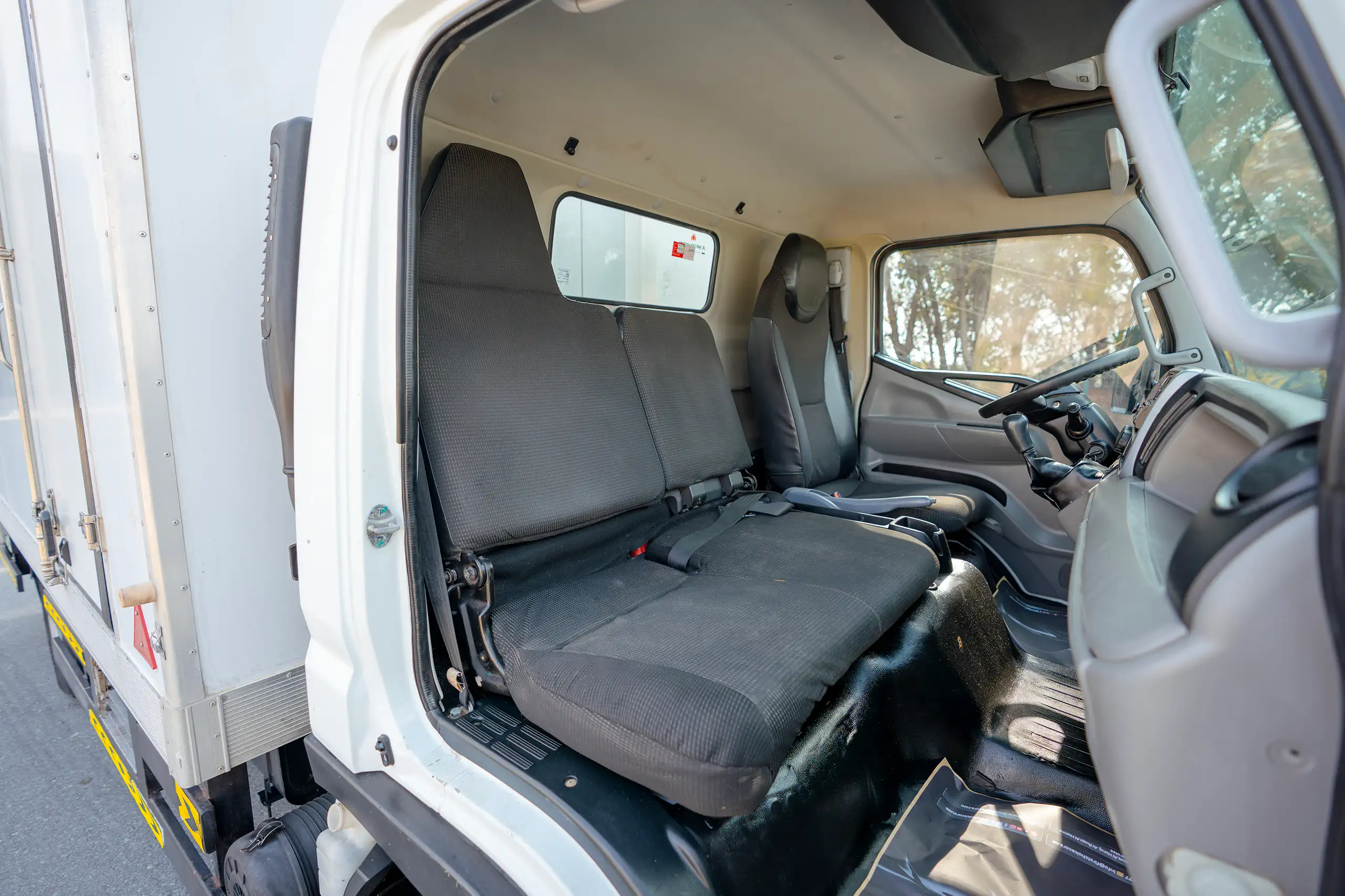 Used 2020 Mitsubishi Canter Chiller Box White – Front Passenger Side Cabin View at First Choice Cars Sharjah