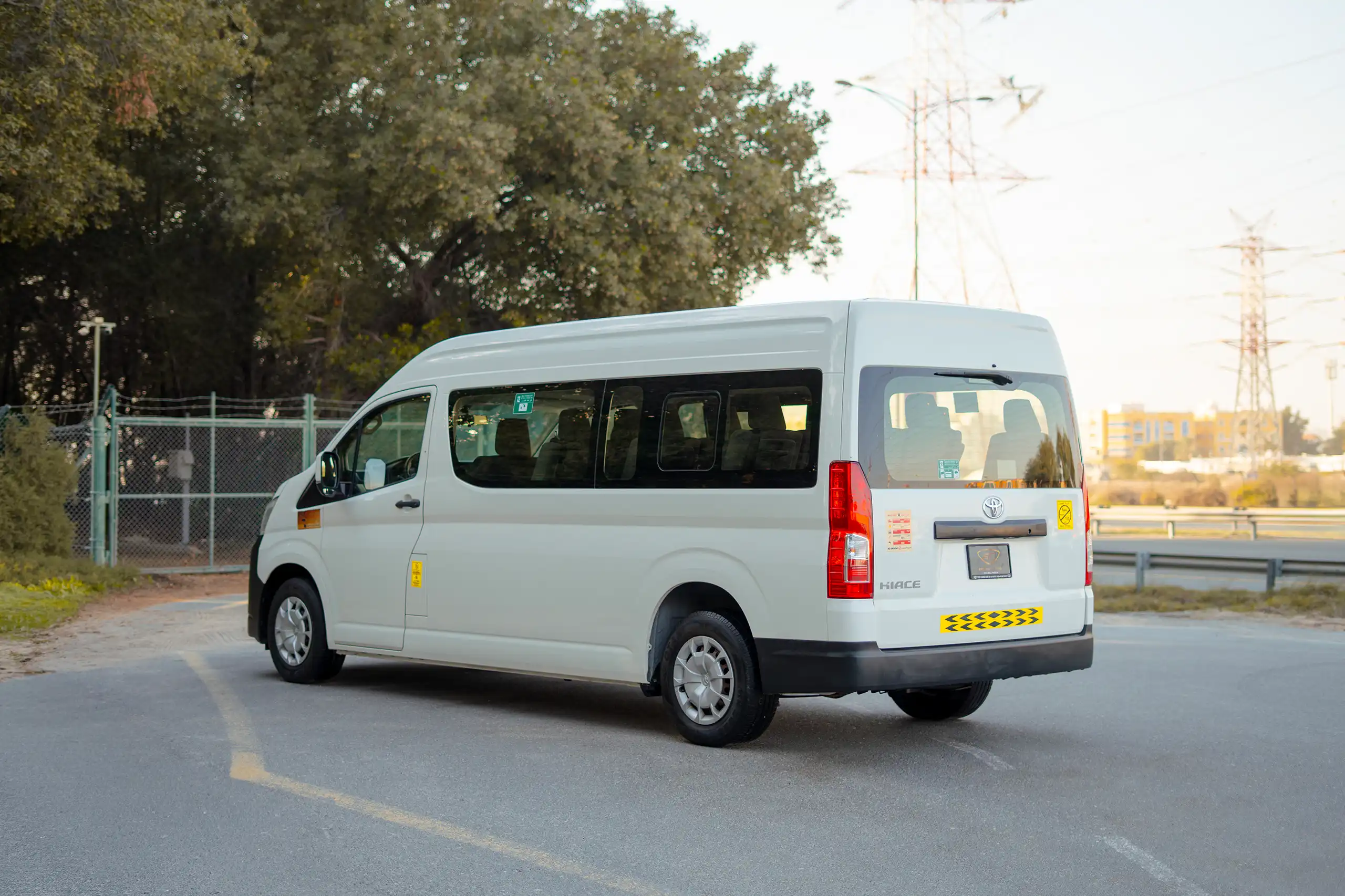 Used 2021 Toyota Hiace GL High Roof White – Left Back Diagonal (45°) View at First Choice Cars Sharjah