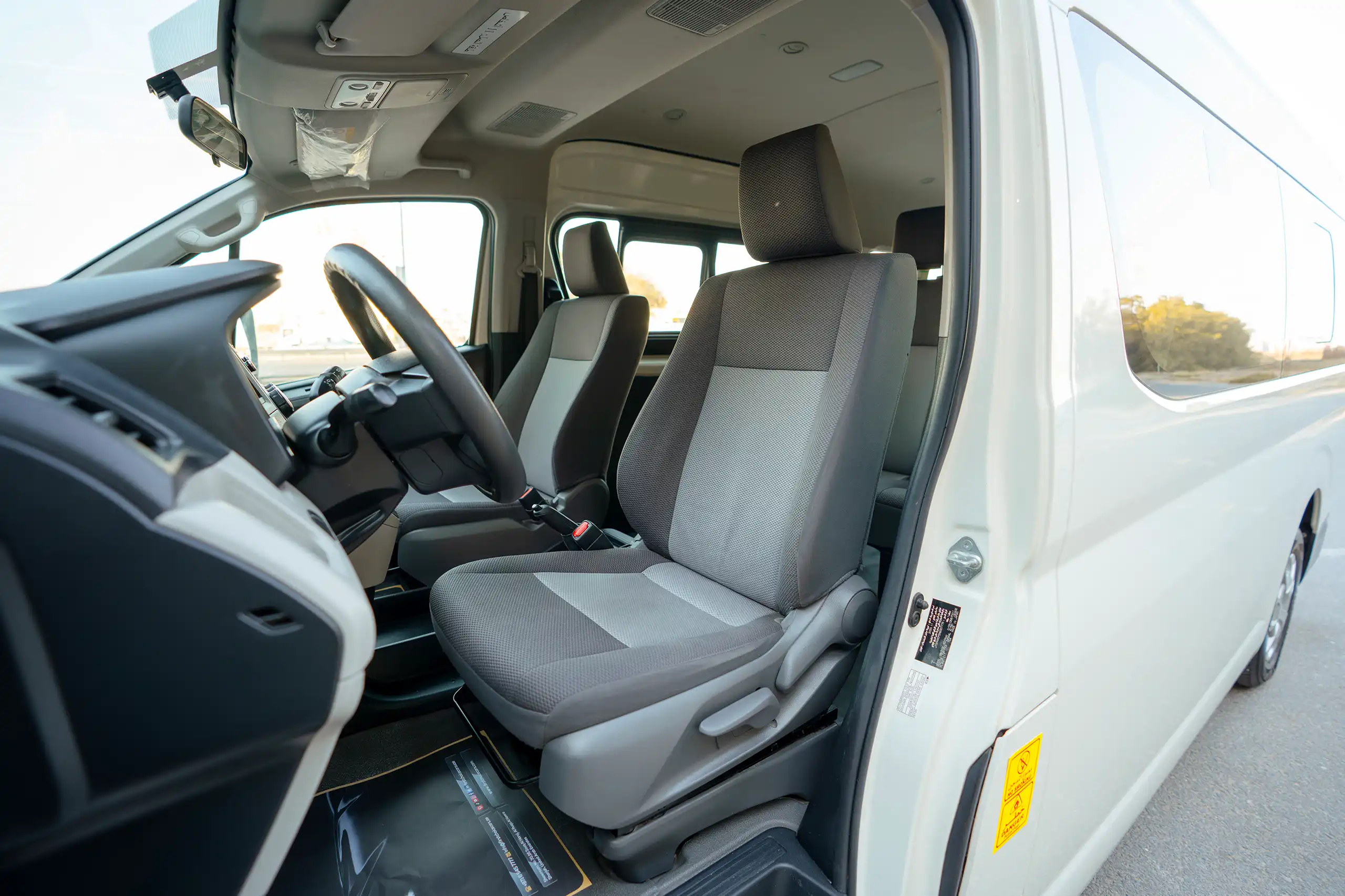 Used 2021 Toyota Hiace GL High Roof White – Front Driver Side Cabin View at First Choice Cars Sharjah