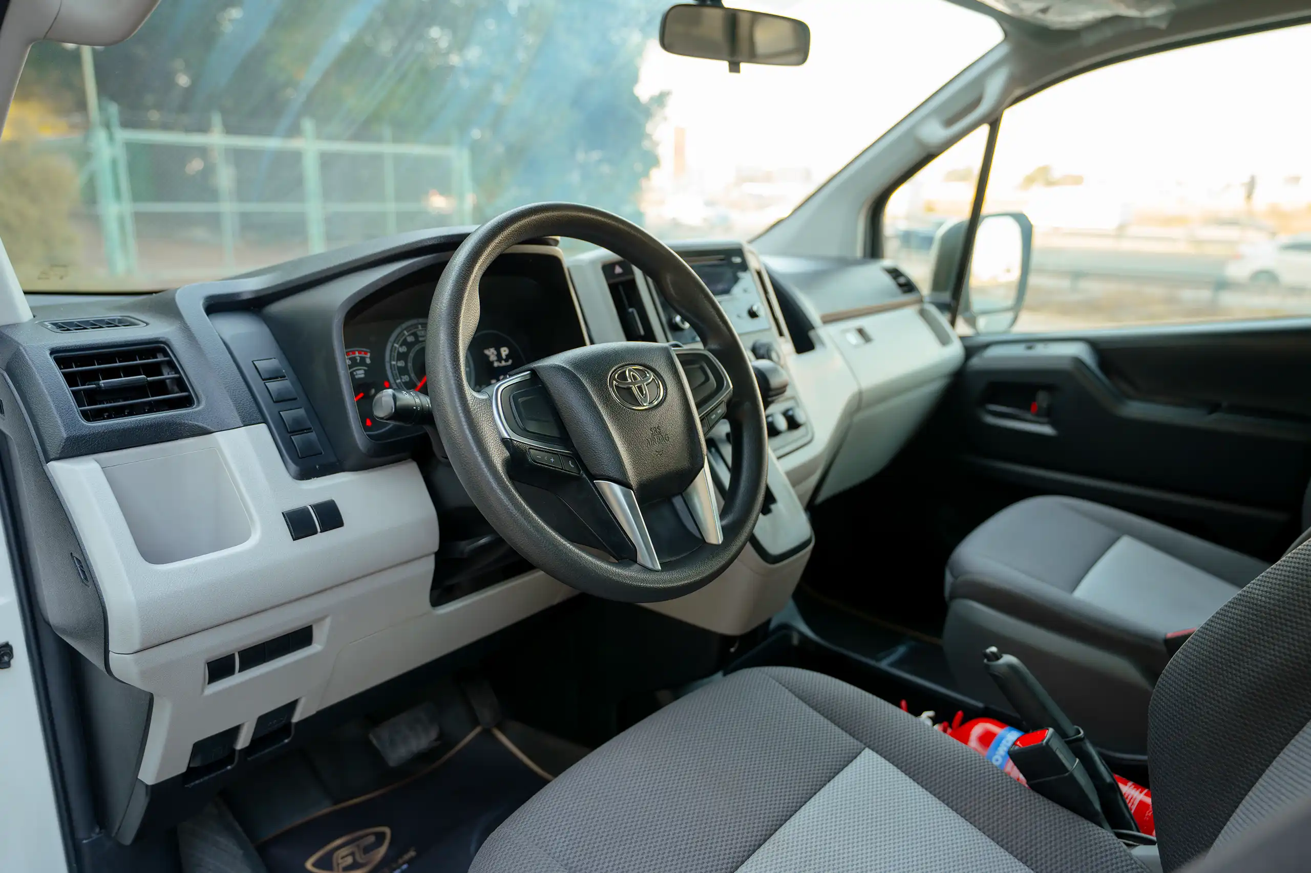 Used 2021 Toyota Hiace GL High Roof White – Driver Side Dashboard & Steering View at First Choice Cars Sharjah