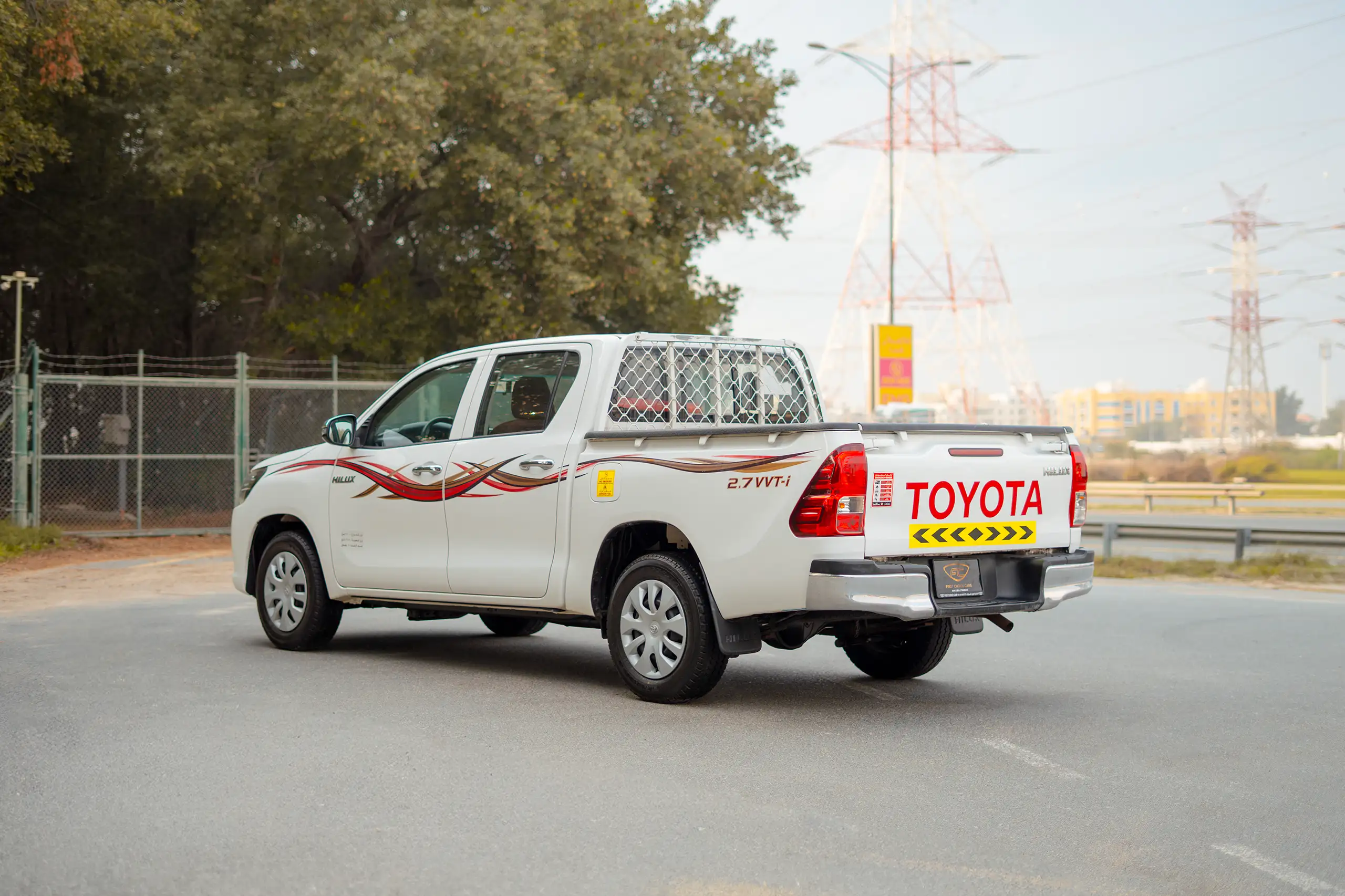 Used 2021 Toyota Hilux GLX Double Cabin White – Left Back Diagonal (45°) View at First Choice Cars Sharjah
