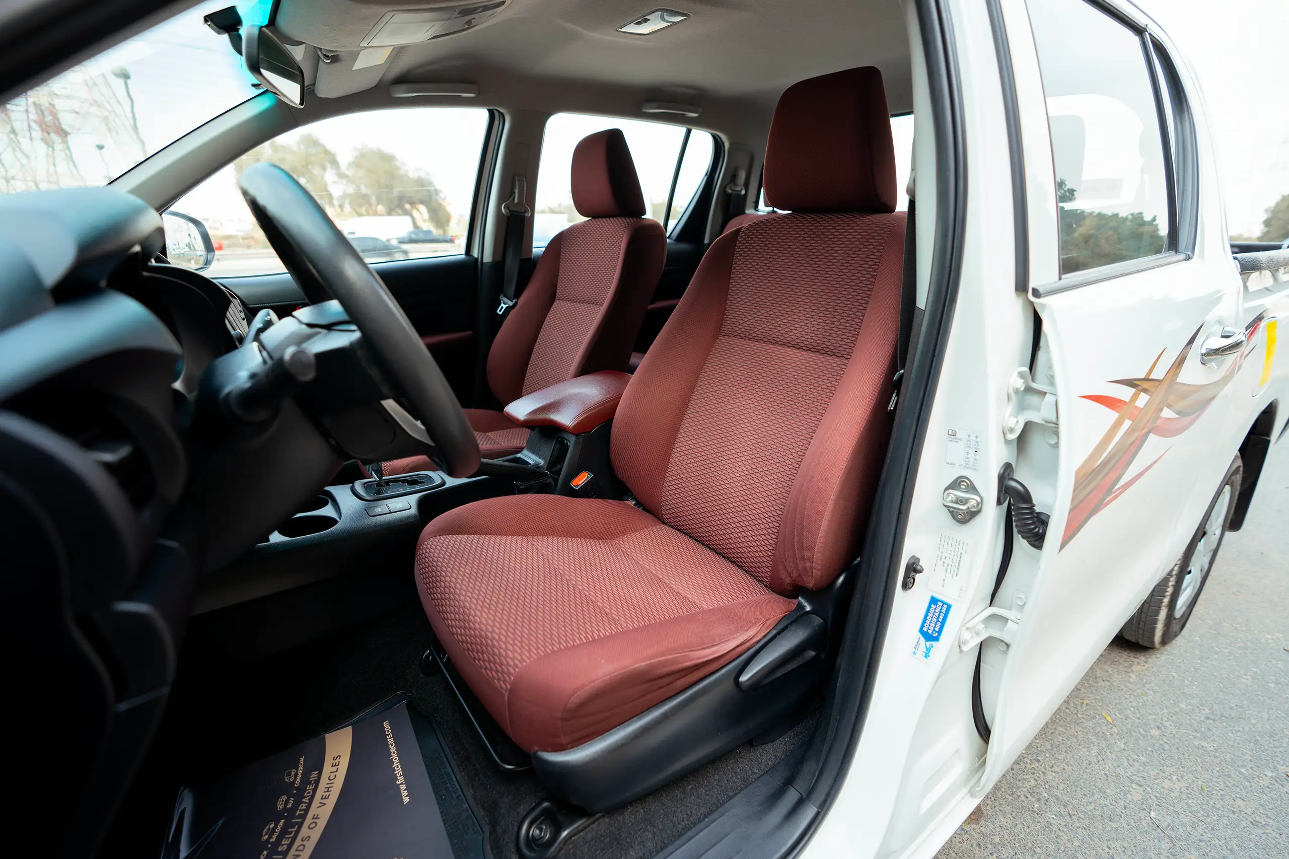 Used 2021 Toyota Hilux GLX Double Cabin White – Front Driver Side Cabin View at First Choice Cars Sharjah