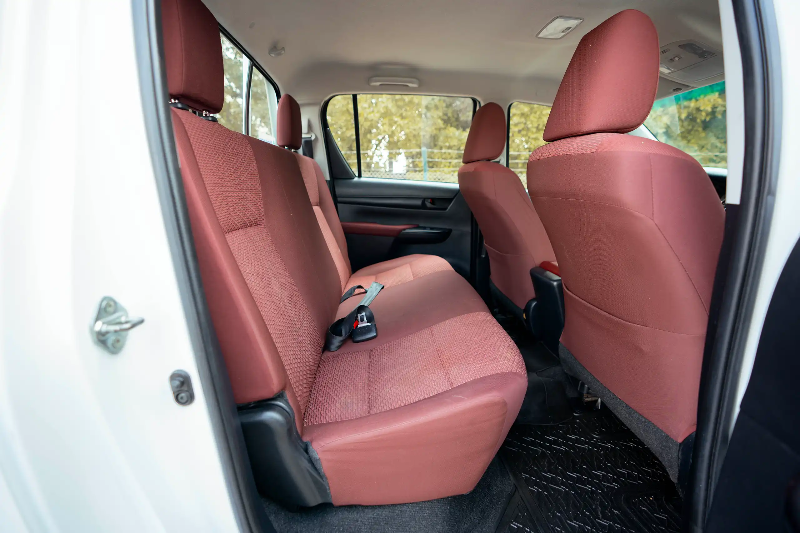 Used 2021 Toyota Hilux GLX Double Cabin White – Rear Passenger Side Cabin View at First Choice Cars Sharjah