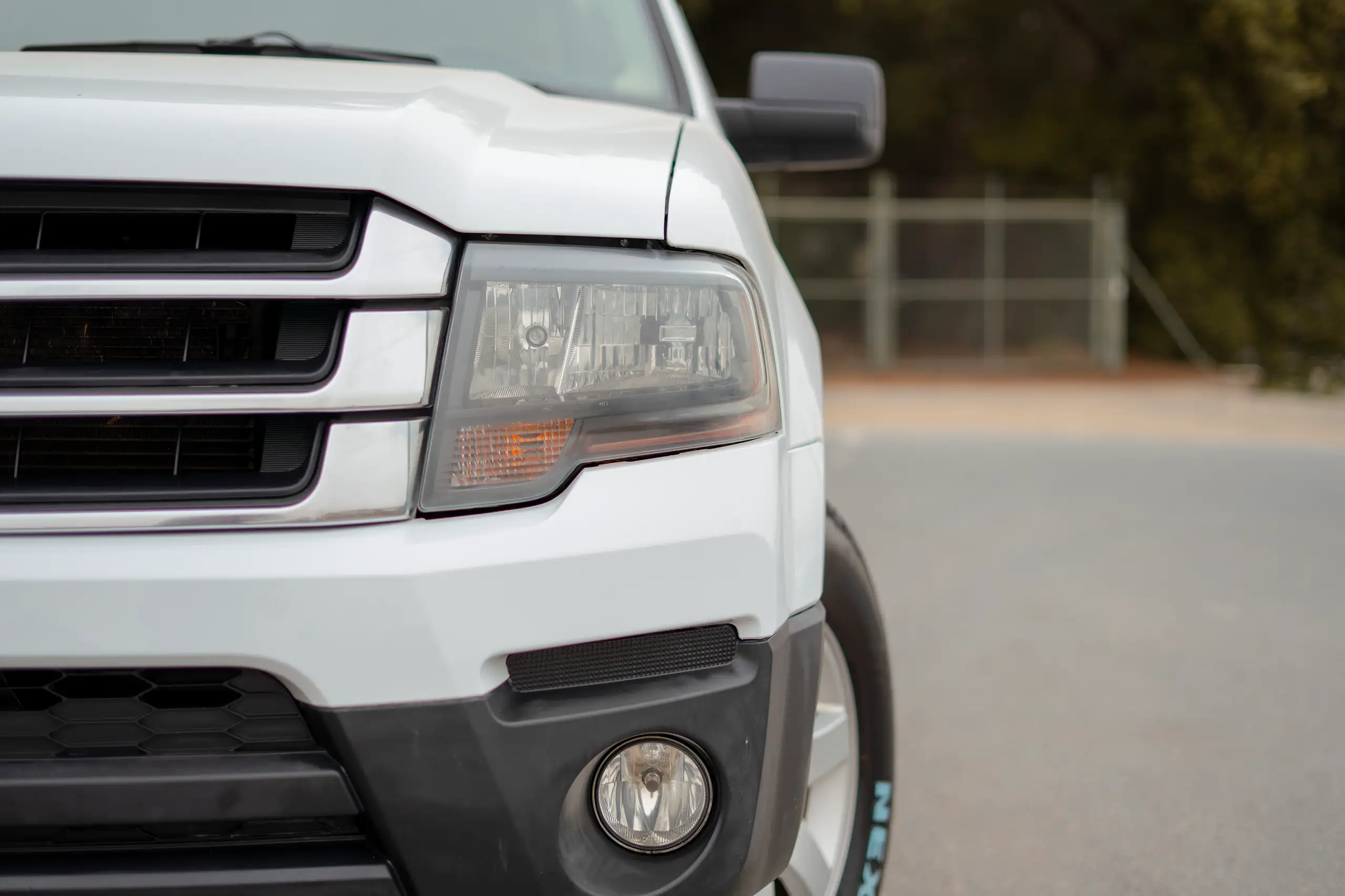 Used 2017 Ford Expedition XLT White – Headlight Close-up at First Choice Cars Sharjah