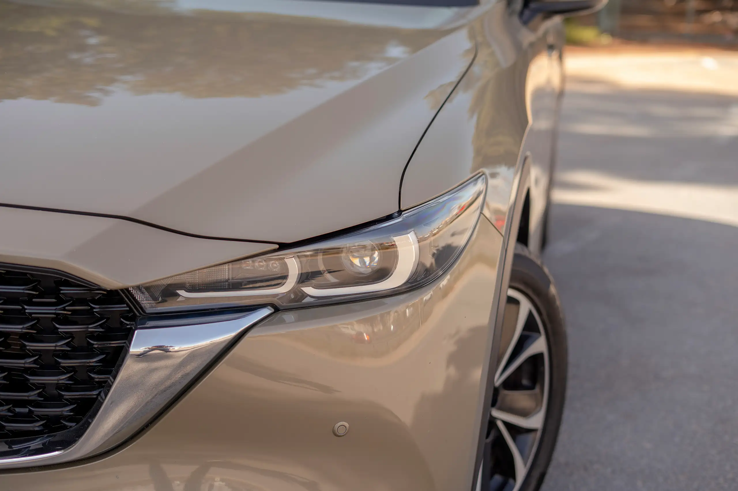 Used 2023 Mazda CX-5 GT Gold – Headlight Close-up at First Choice Cars Sharjah