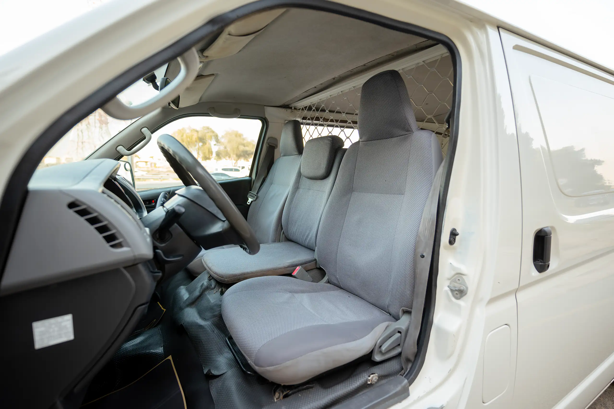 Used 2009 Toyota Hiace GL Standard Roof White – Front Driver Side Cabin View at First Choice Cars Sharjah