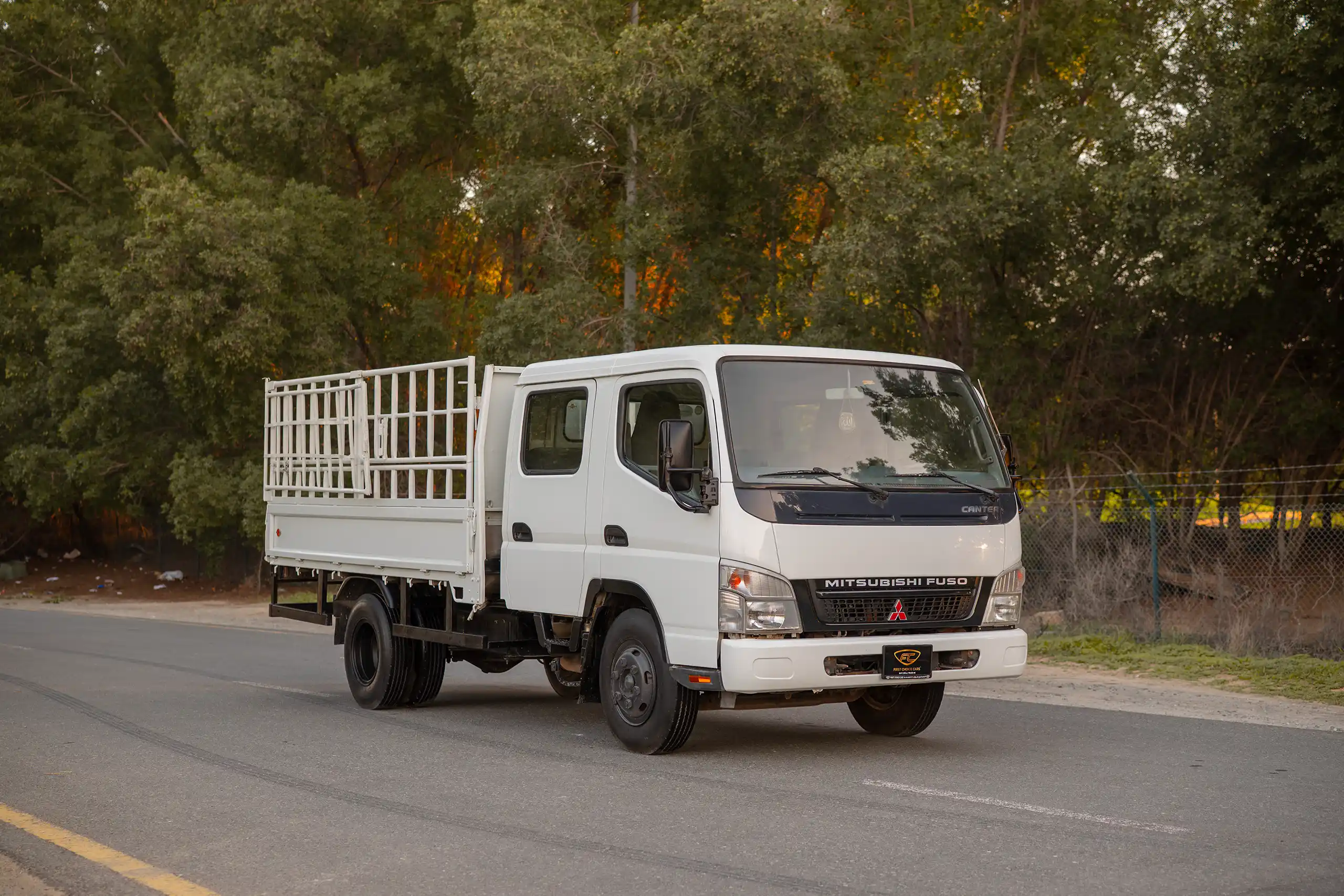 Used 2006 Mitsubishi Canter Double Cabin Cargo Body White – Right Front Diagonal (45°) View at First Choice Cars Sharjah