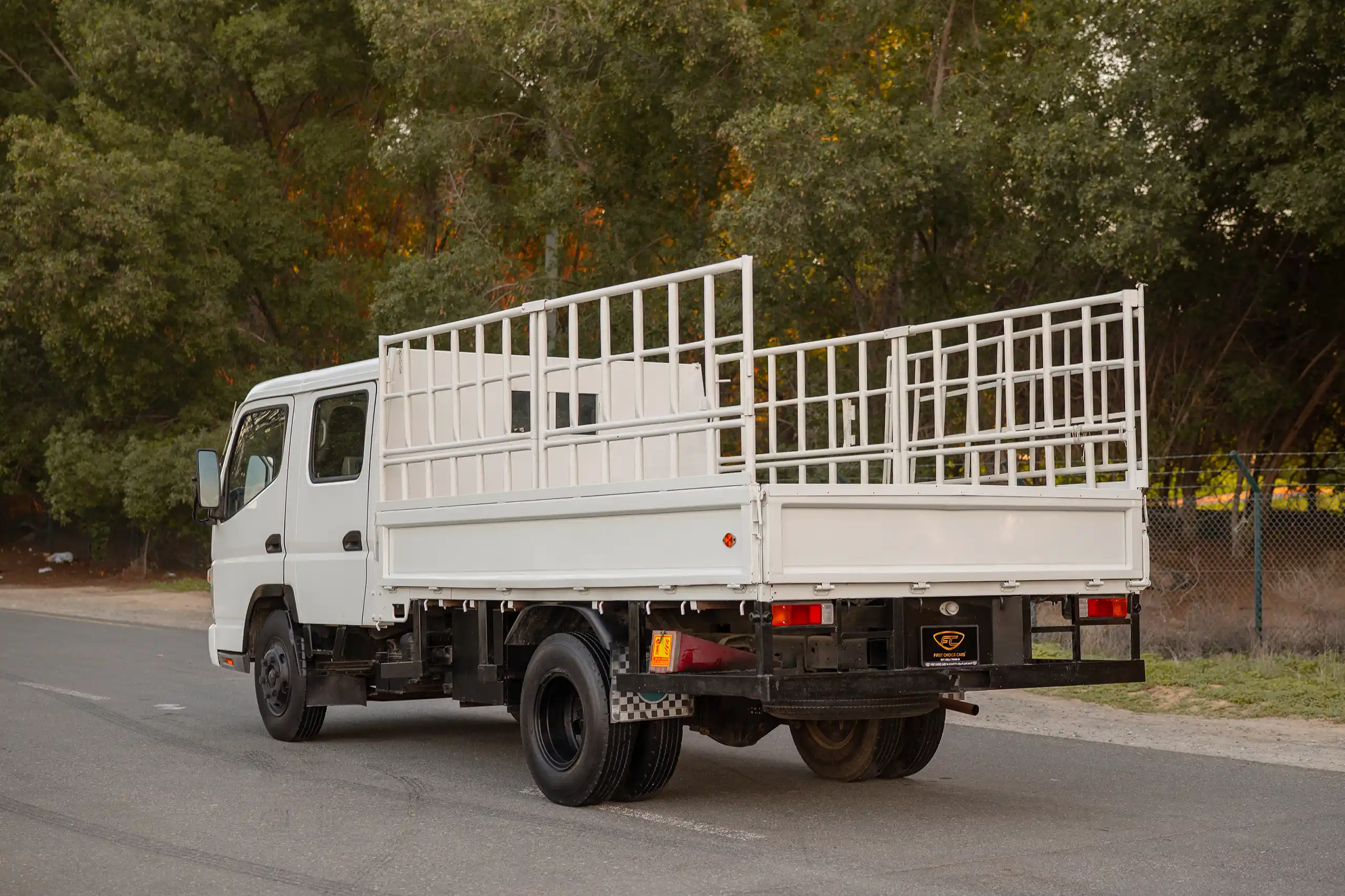Used 2006 Mitsubishi Canter Double Cabin Cargo Body White – Left Back Diagonal (45°) View at First Choice Cars Sharjah