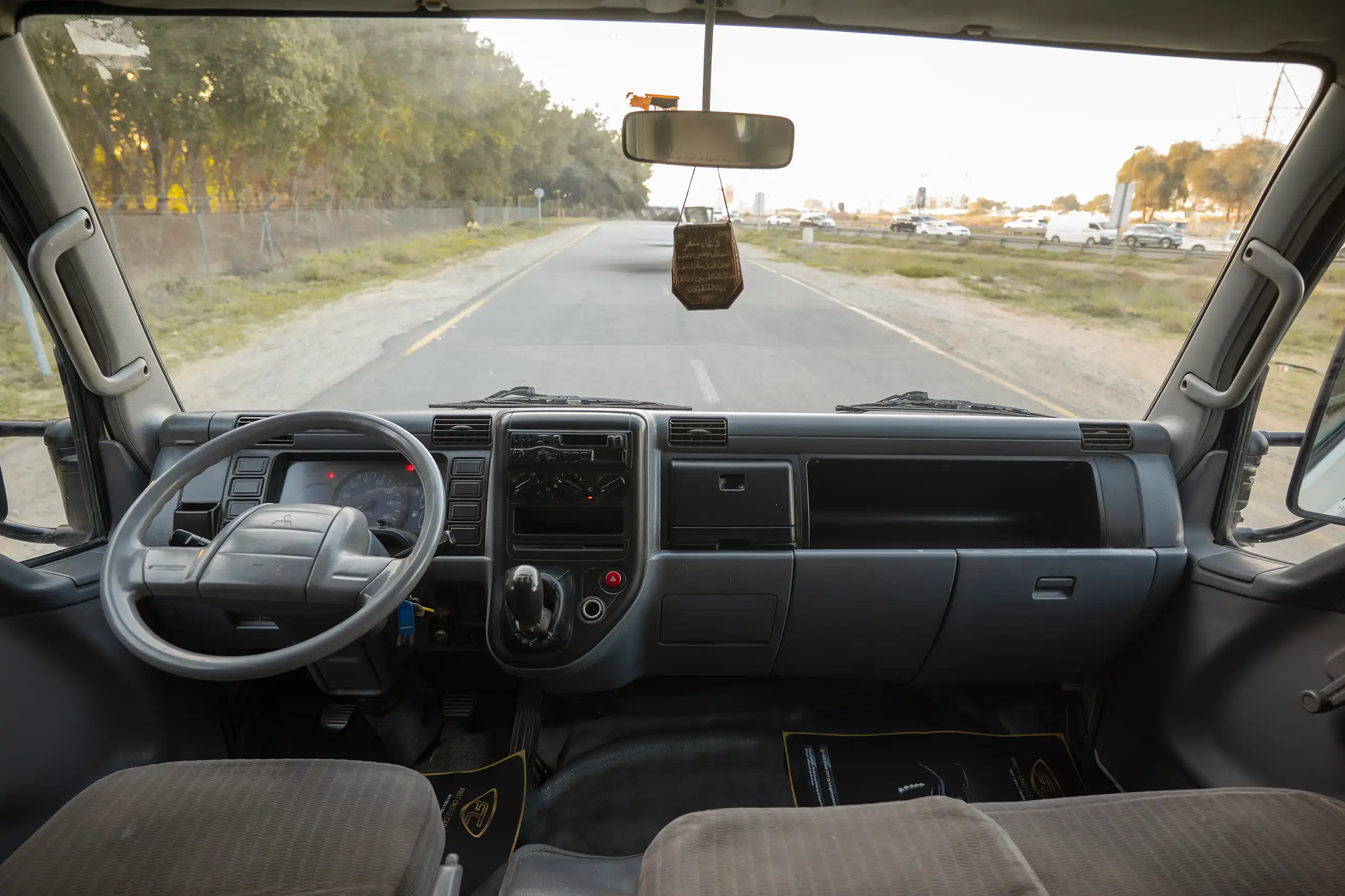 Used 2006 Mitsubishi Canter Double Cabin Cargo Body White – Front Cabin / Dashboard Full View at First Choice Cars Sharjah