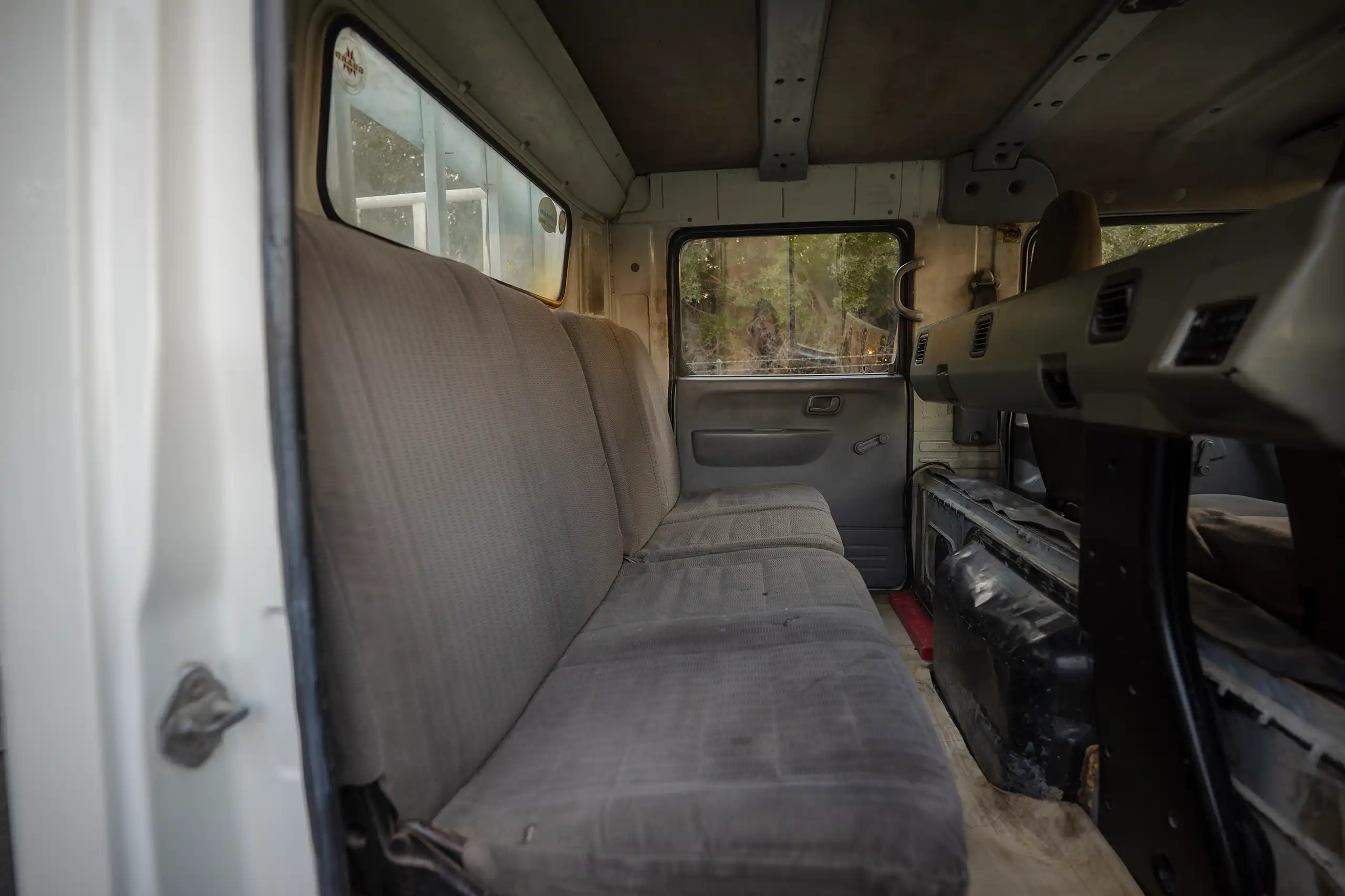 Used 2006 Mitsubishi Canter Double Cabin Cargo Body White – Rear Passenger Side Cabin View at First Choice Cars Sharjah