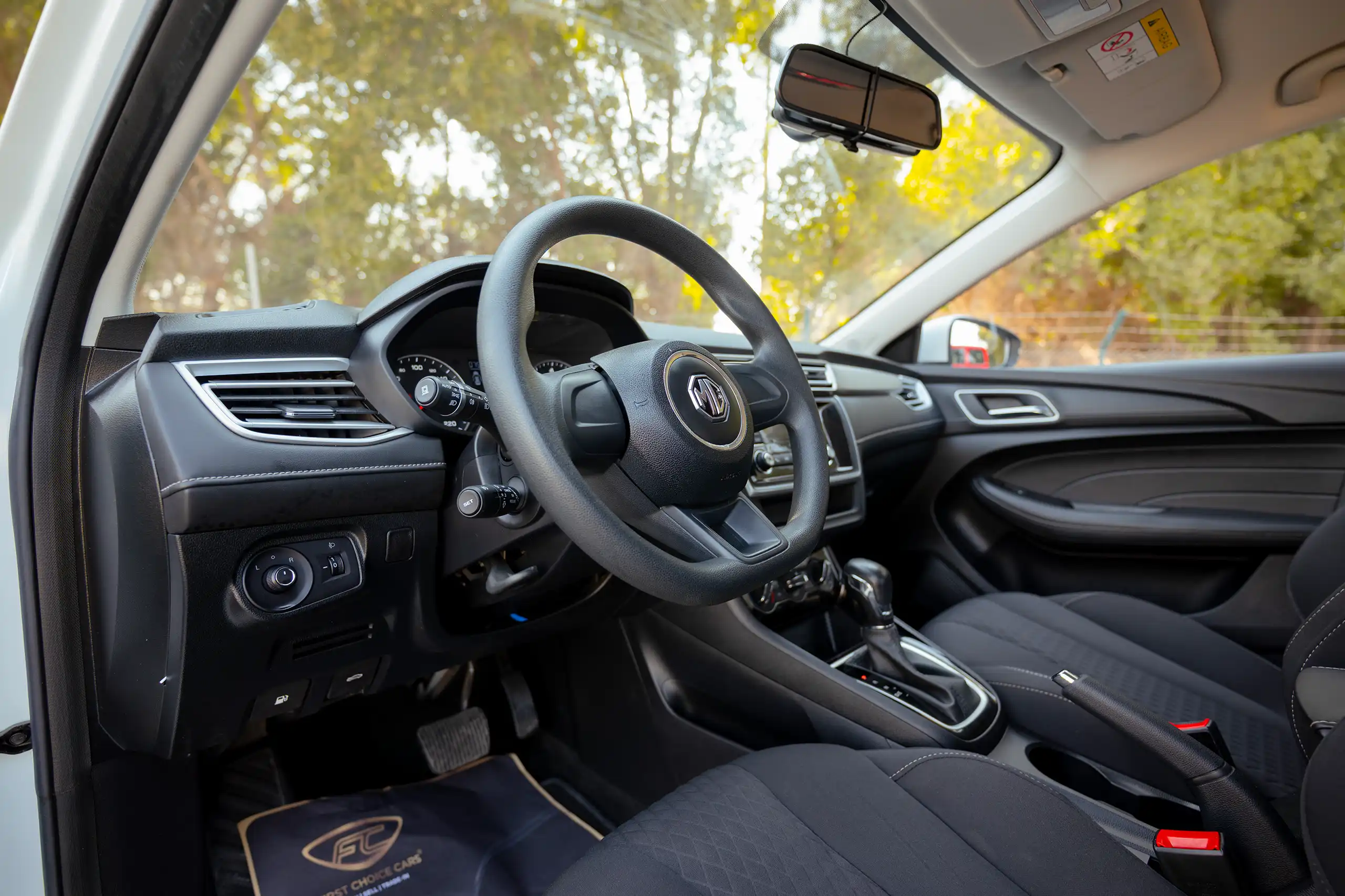 Used 2022 MG 5 Comfort White – Driver Side Dashboard & Steering View at First Choice Cars Sharjah