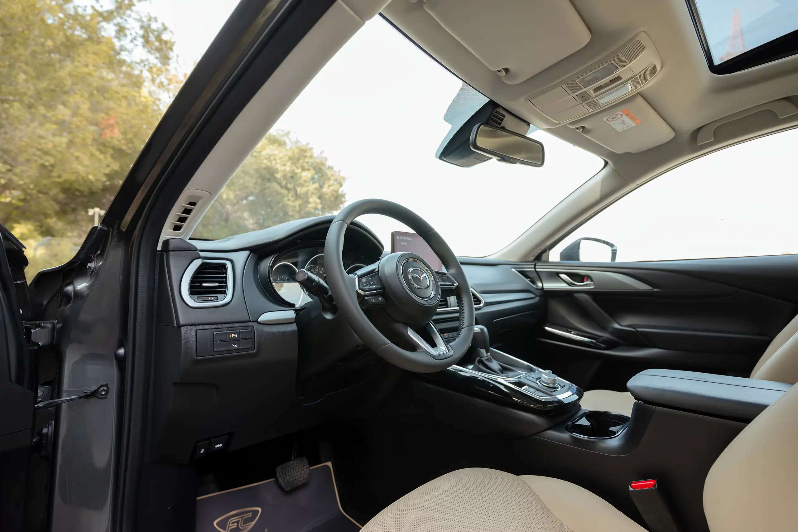 Used 2020 Mazda CX-9 GT Grey – Driver Side Dashboard & Steering View at First Choice Cars Sharjah