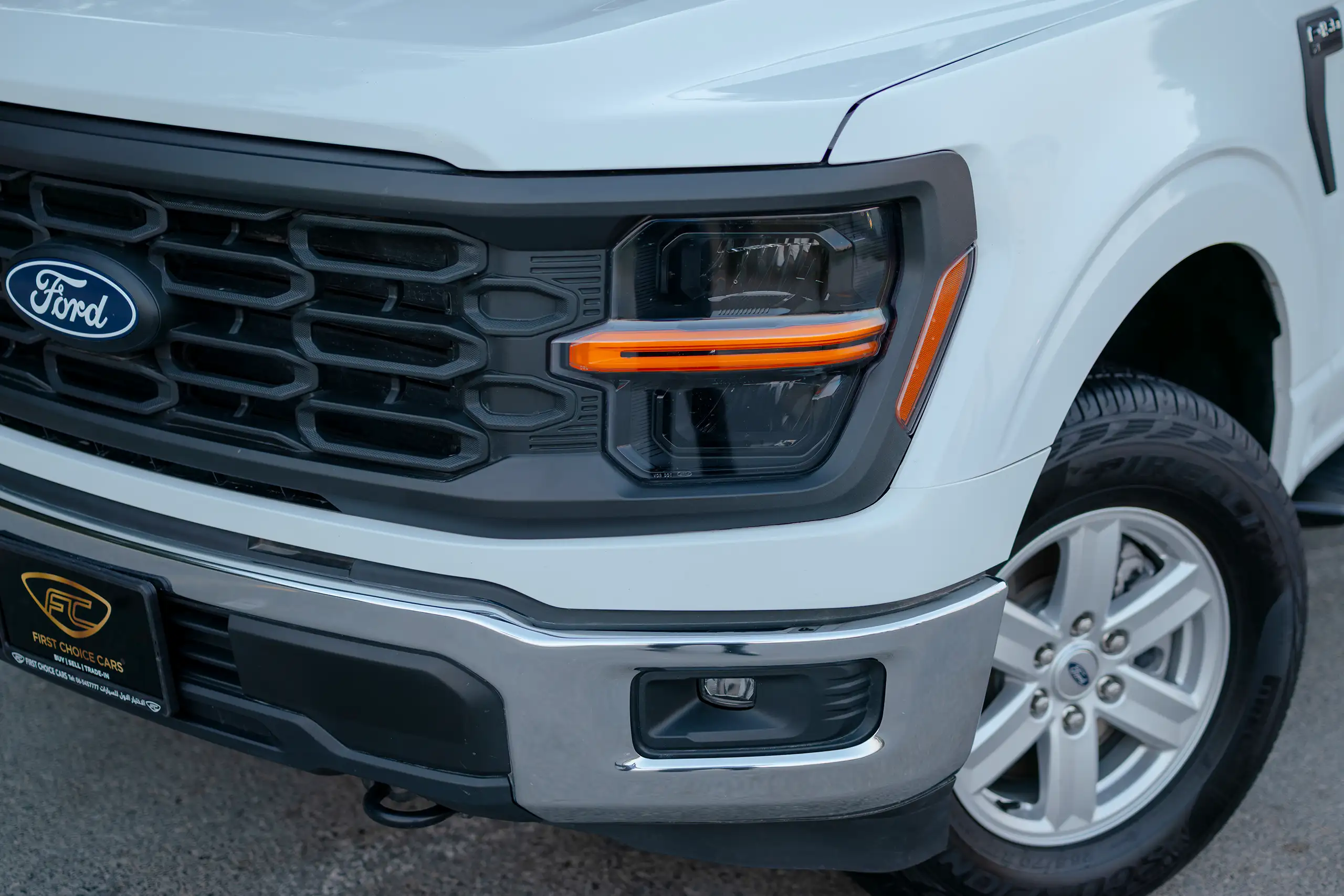 Used 2025 Ford F-Series Pickup F-150 XL White – Headlight Close-up at First Choice Cars Sharjah