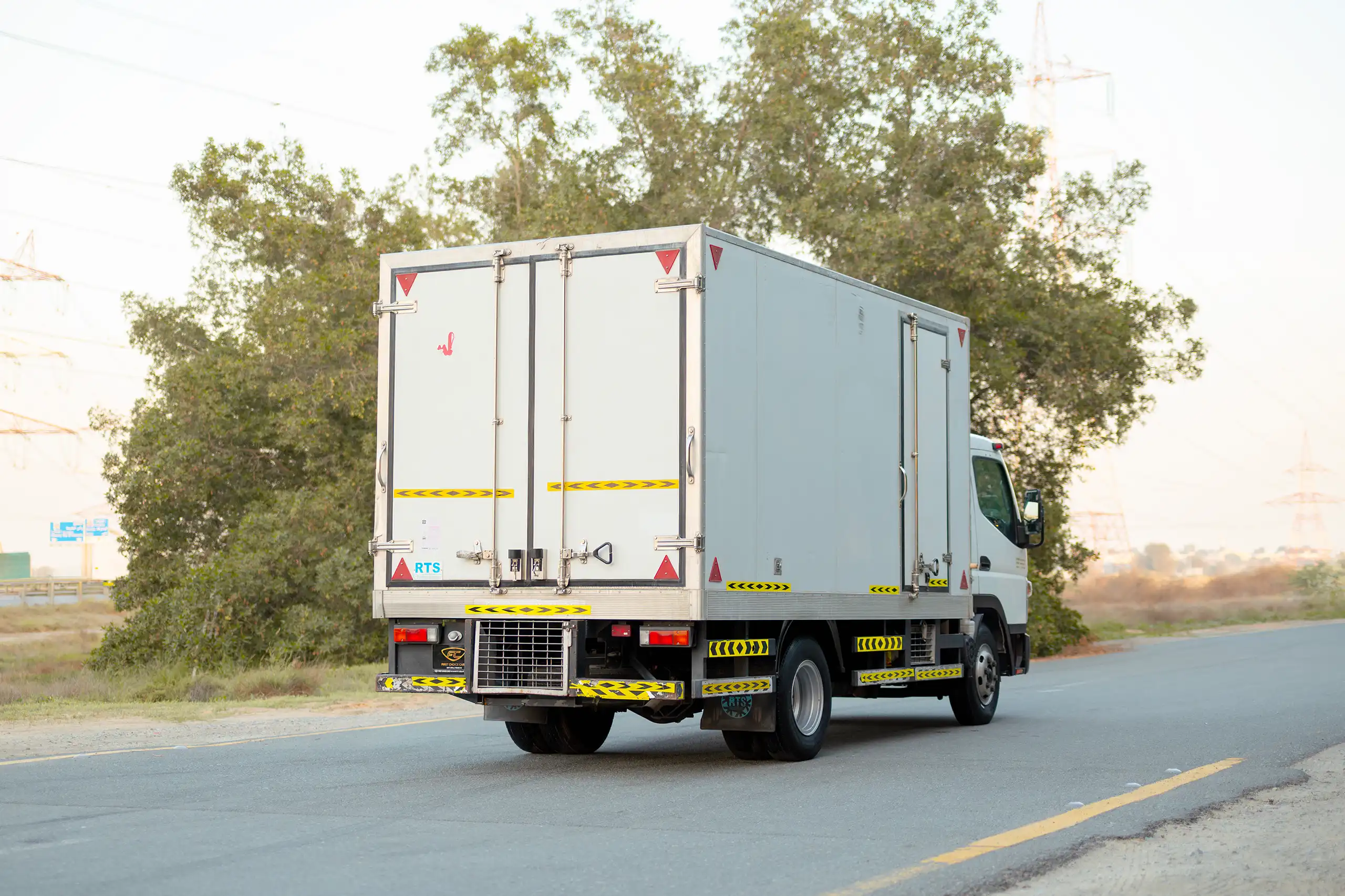 Used 2020 Mitsubishi Canter Chiller Box White – Right Back Diagonal (45°) View at First Choice Cars Sharjah