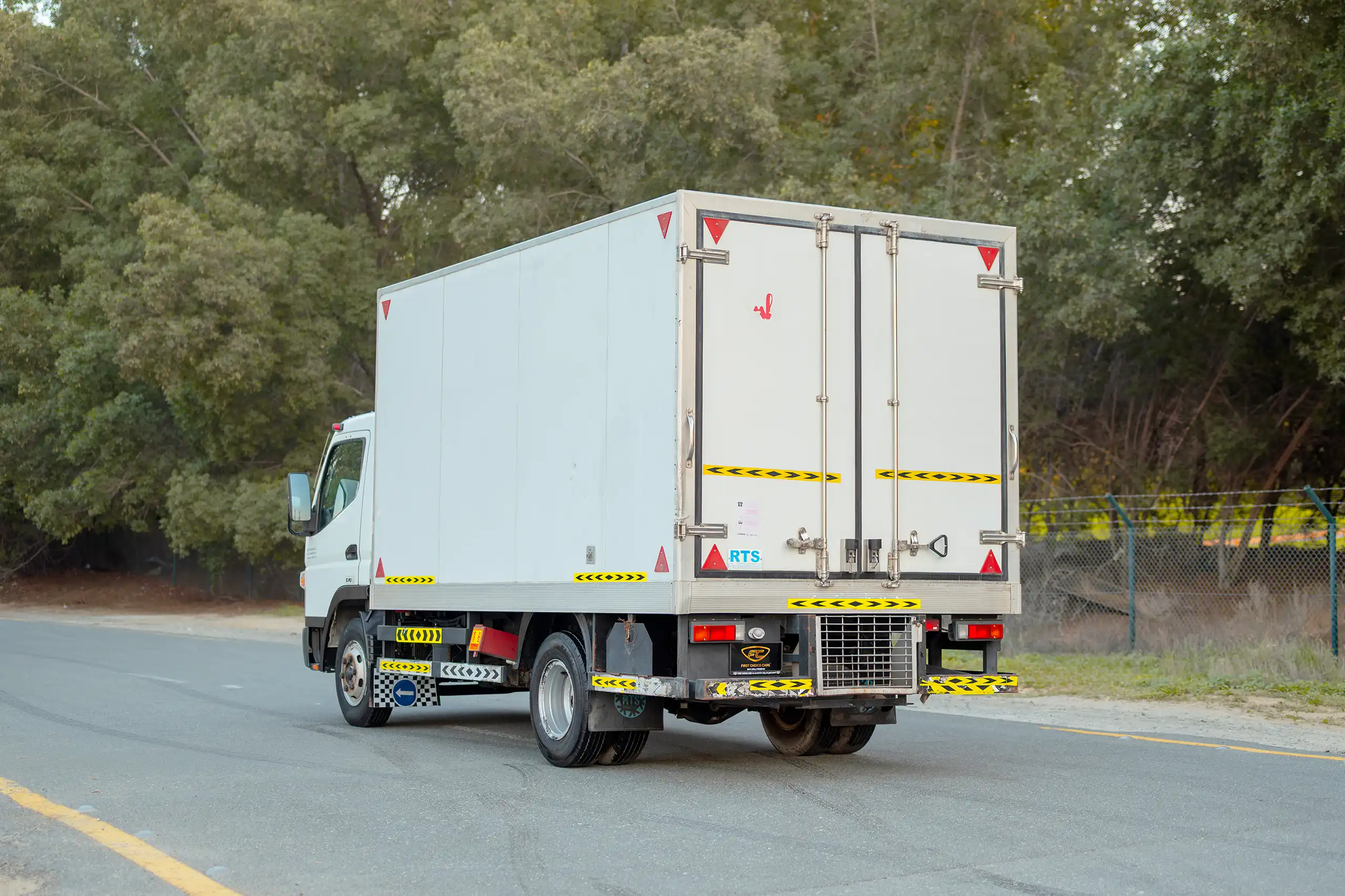 Used 2020 Mitsubishi Canter Chiller Box White – Left Back Diagonal (45°) View at First Choice Cars Sharjah