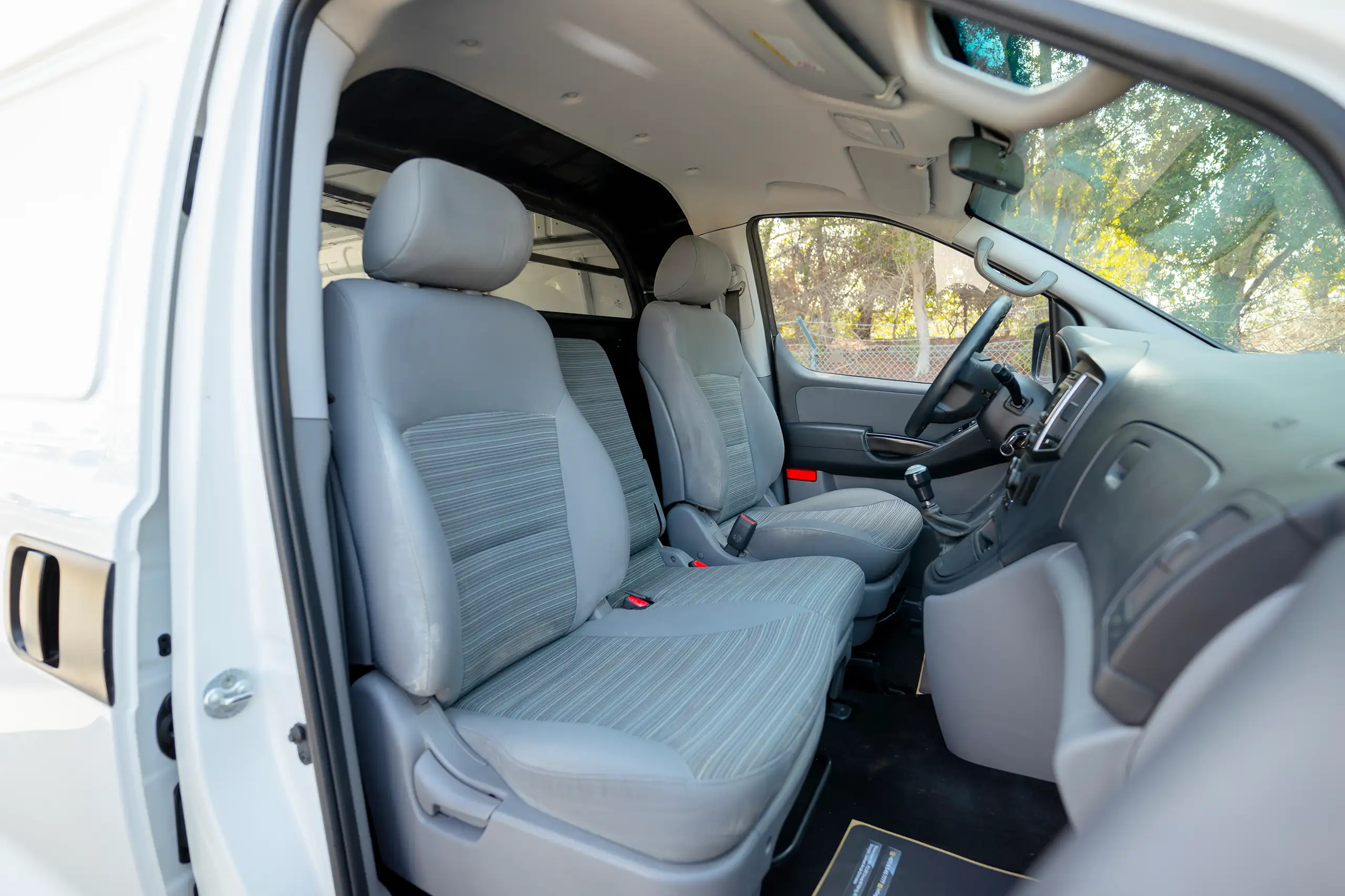 Used 2021 Hyundai H1 Cargo Van White – Front Passenger Side Cabin View at First Choice Cars Sharjah