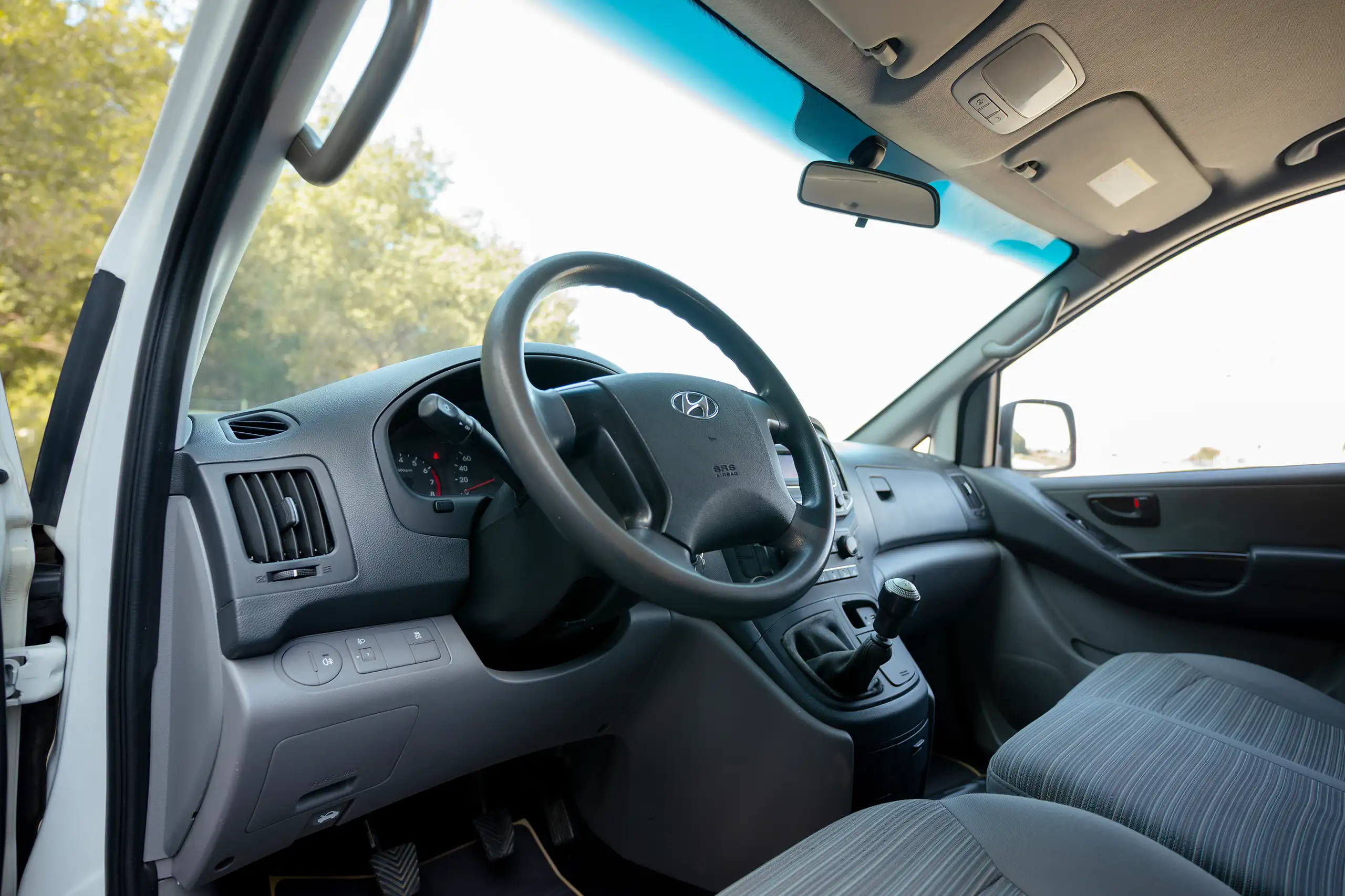 Used 2021 Hyundai H1 Cargo Van White – Driver Side Dashboard & Steering View at First Choice Cars Sharjah