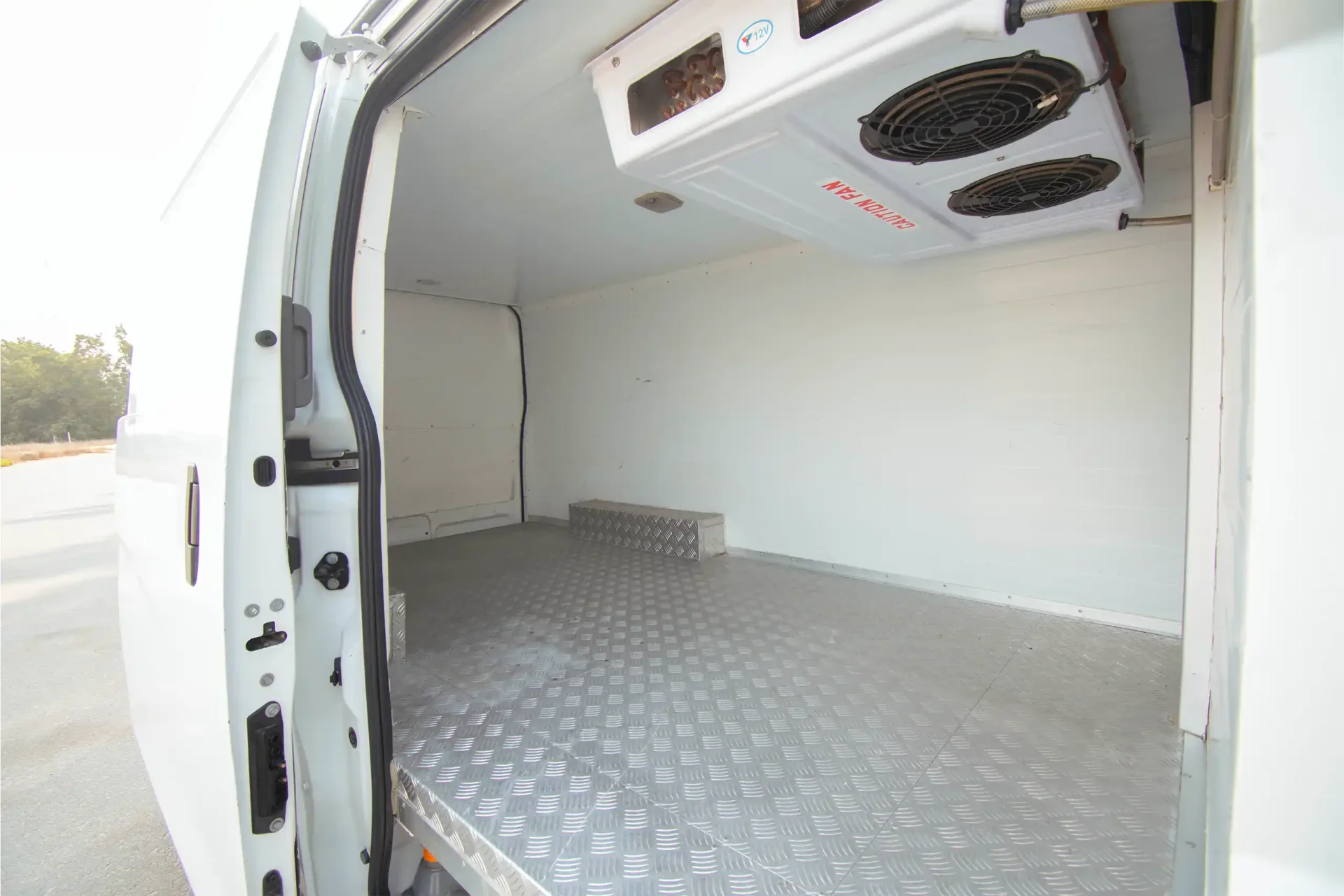 Used 2021 Nissan Urvan Standard Roof in White – Chiller Box Right Side Interior View for Sale at First Choice Cars Dubai Sharjah