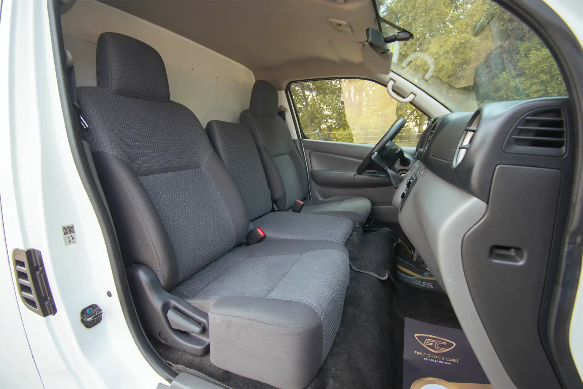 Used 2021 Nissan Urvan Standard Roof in White – Front Passenger Side Cabin View for Sale at First Choice Cars Dubai Sharjah
