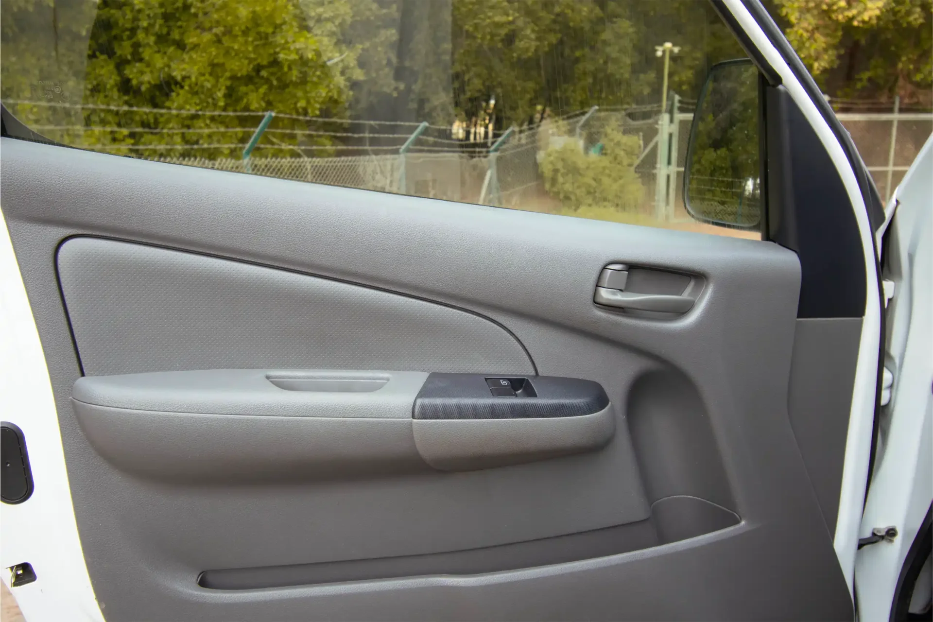 Used 2021 Nissan Urvan Standard Roof in White – Driver Door Panel Full View for Sale at First Choice Cars Dubai Sharjah