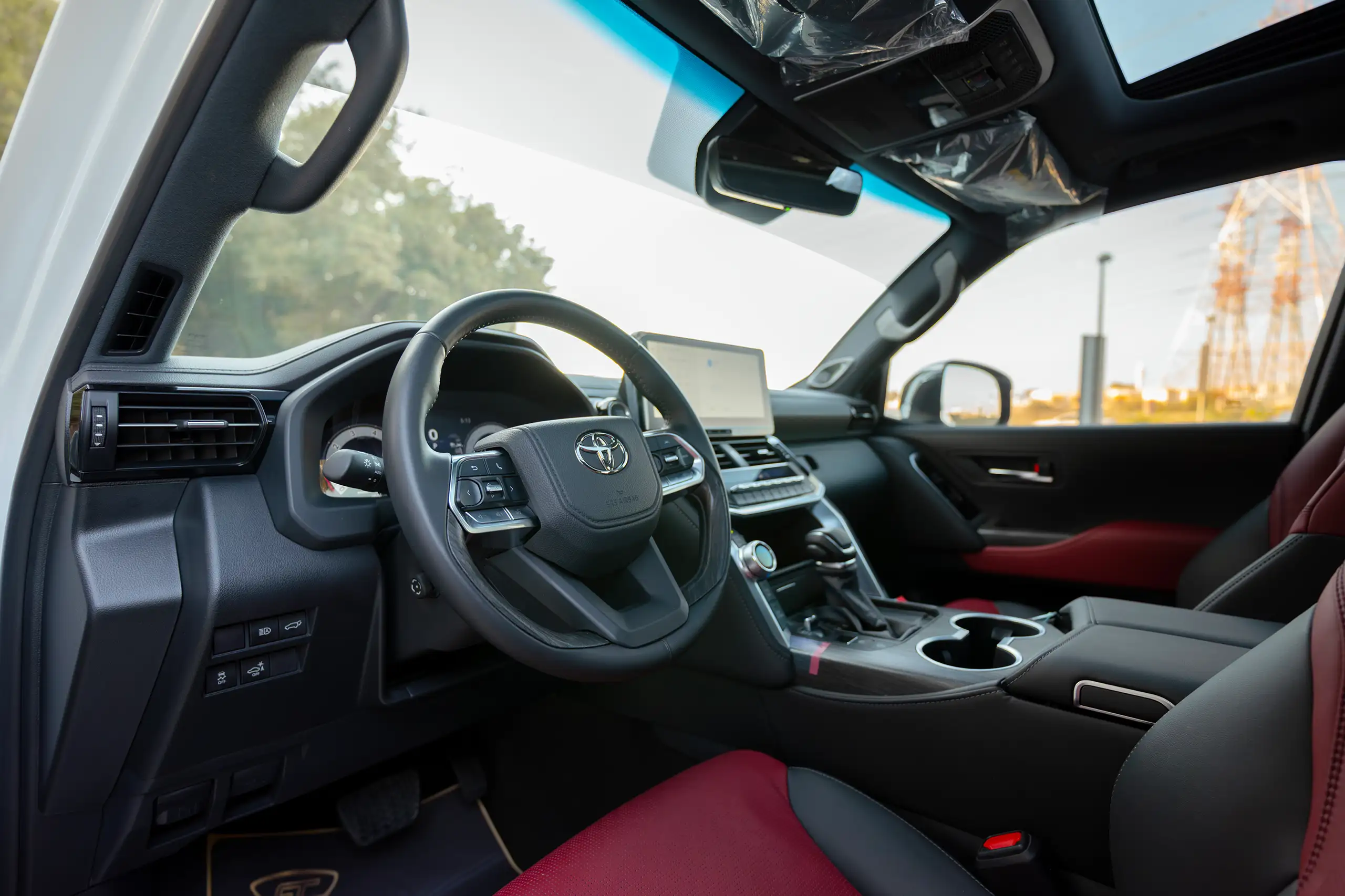 Used 2025 Toyota Land Cruiser VXR White – Driver Side Dashboard & Steering View at First Choice Cars Sharjah