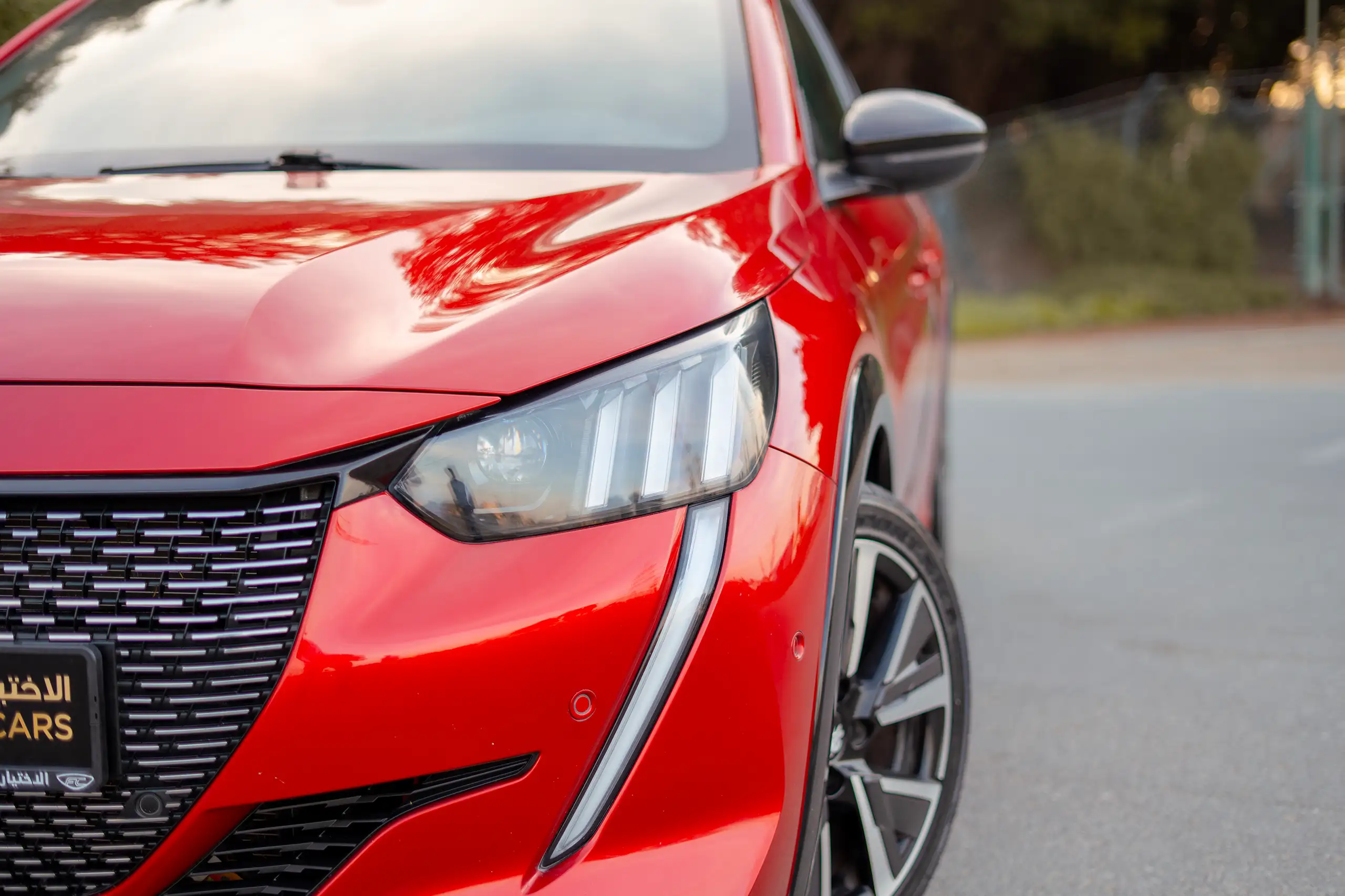 Used 2023 Peugeot 208 GT Red – Headlight Close-up at First Choice Cars Sharjah