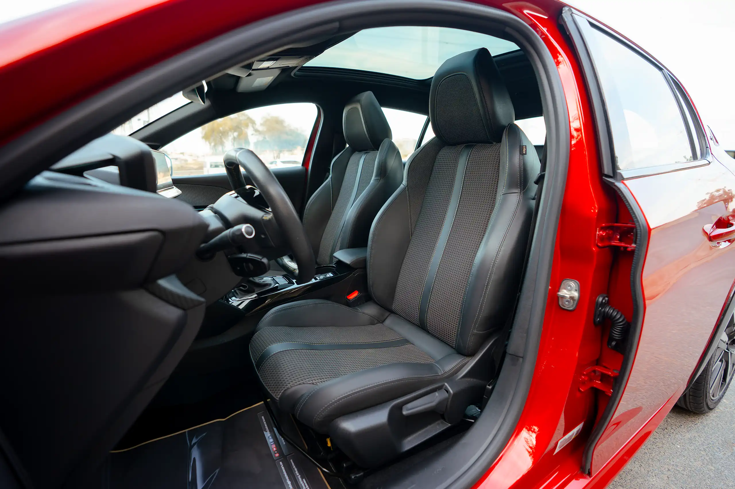 Used 2023 Peugeot 208 GT Red – Front Driver Side Cabin View at First Choice Cars Sharjah