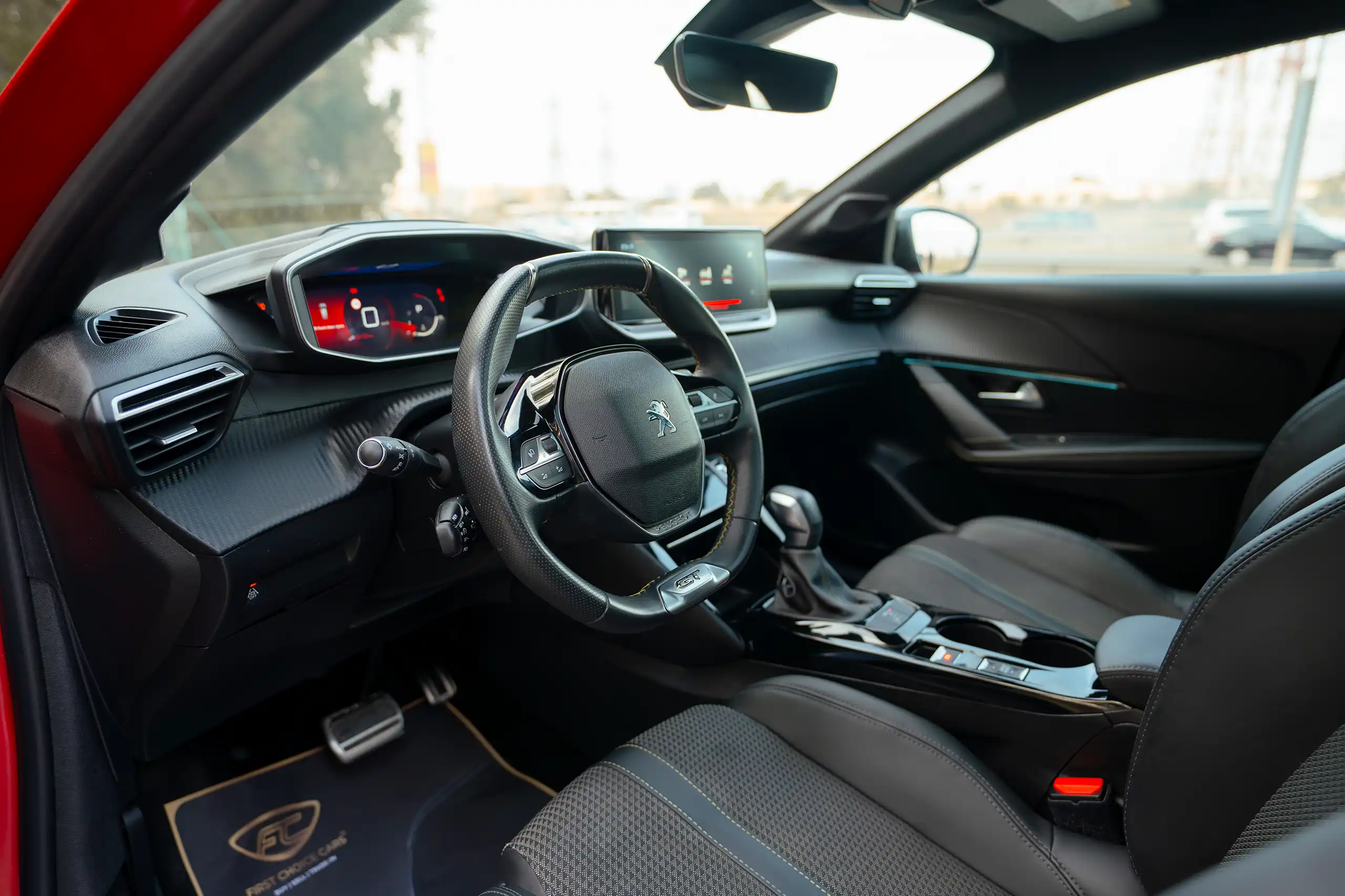Used 2023 Peugeot 208 GT Red – Driver Side Dashboard & Steering View at First Choice Cars Sharjah