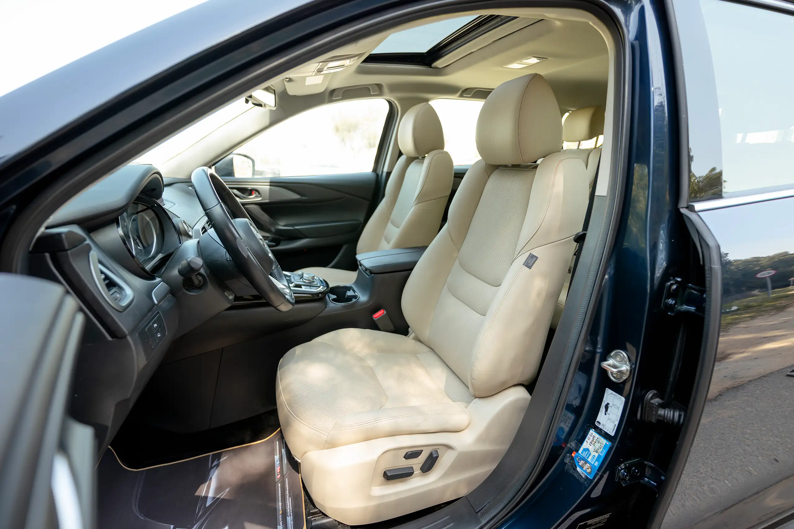 Used 2023 Mazda CX-9 GT in Blue – Front Driver Side Cabin View for Sale at First Choice Cars Dubai Sharjah