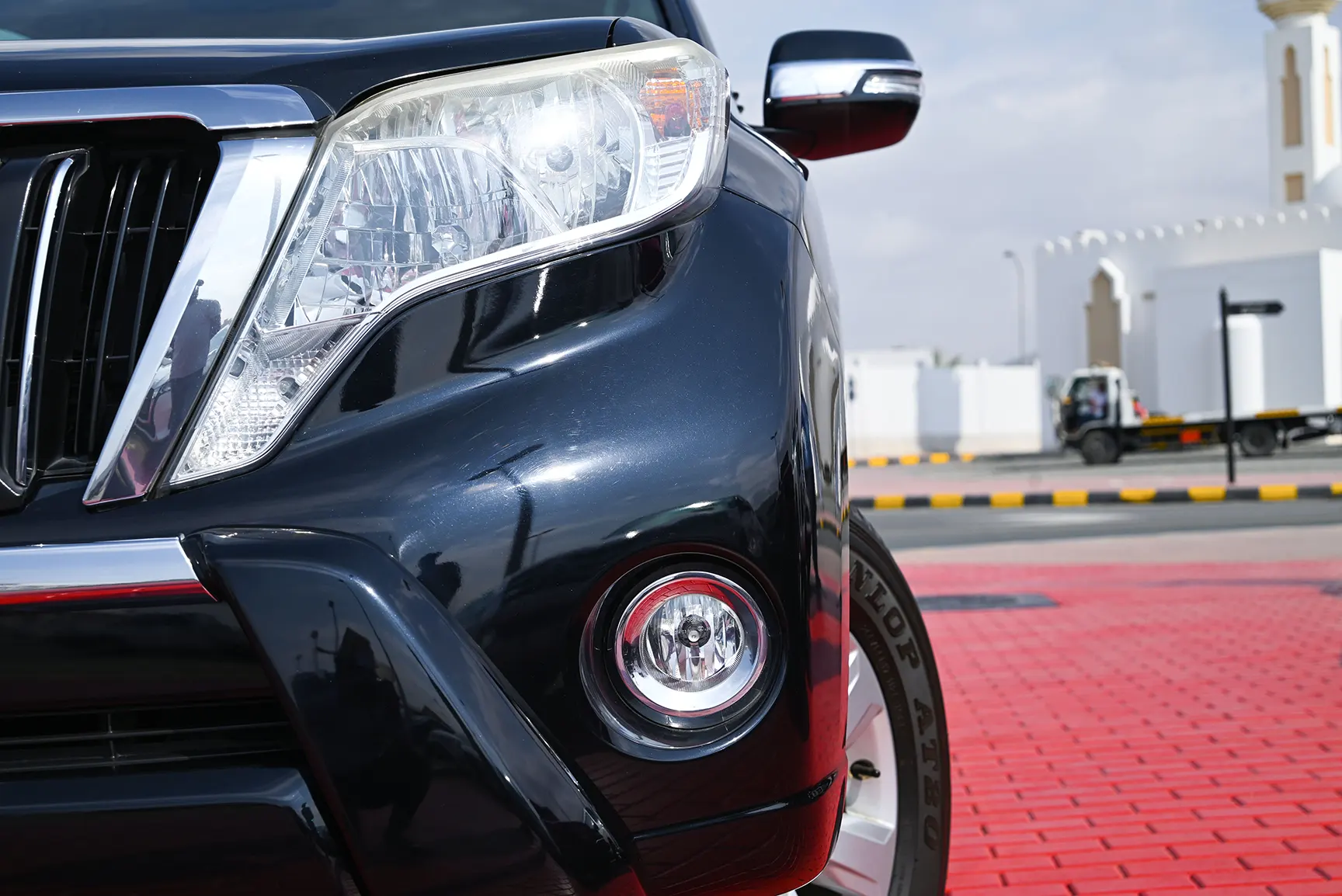 Used 2014 Toyota Prado Gxr Black – Headlight Close-up at First Choice Cars Sharjah