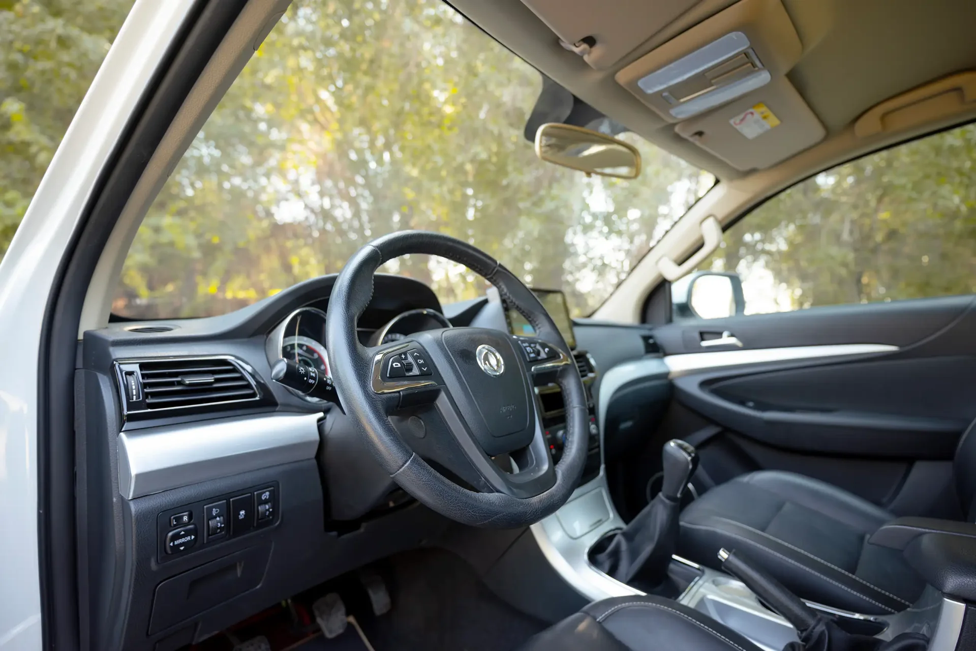 Used 2024 Dongfeng RICH 6 Double Cabin in White – Driver Side Dashboard & Steering View for Sale at First Choice Cars Dubai Sharjah