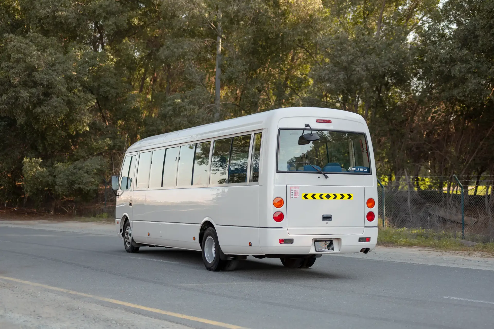 Used 2022 Mitsubishi ROSA Passenger Bus in White – Left Back Diagonal (45°) View for Sale at First Choice Cars Dubai Sharjah
