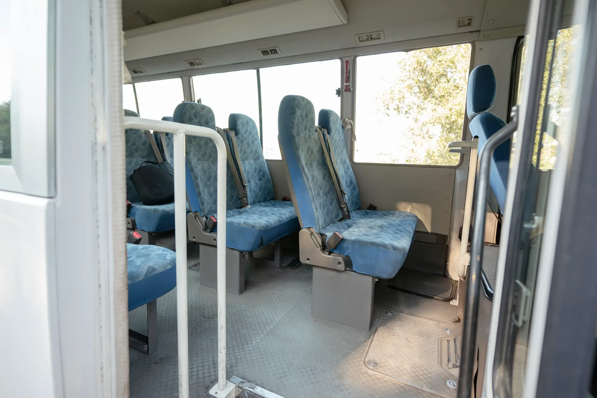 Used 2022 Mitsubishi ROSA Passenger Bus in White – Rear Passenger Side Cabin View for Sale at First Choice Cars Dubai Sharjah