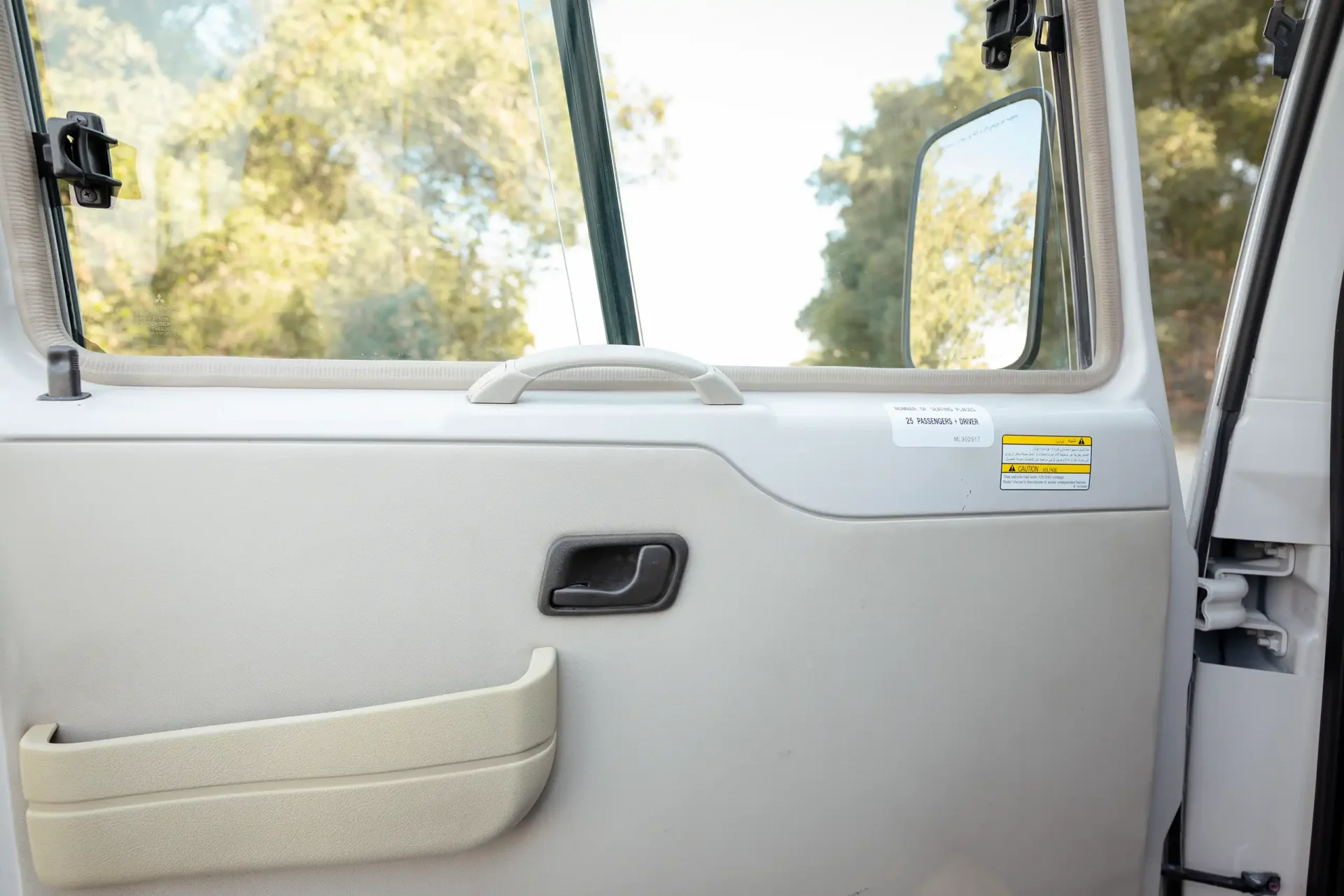 Used 2022 Mitsubishi ROSA Passenger Bus in White – Driver Door Panel Full View for Sale at First Choice Cars Dubai Sharjah