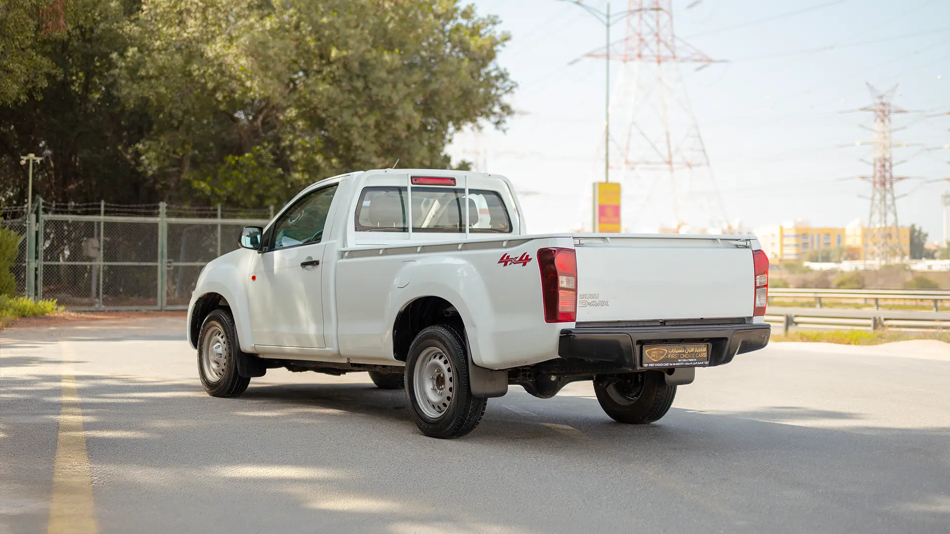 Used 2024 Isuzu D-MAX Single Cabin in White – Left Back Diagonal (45°) View for Sale at First Choice Cars Dubai Sharjah