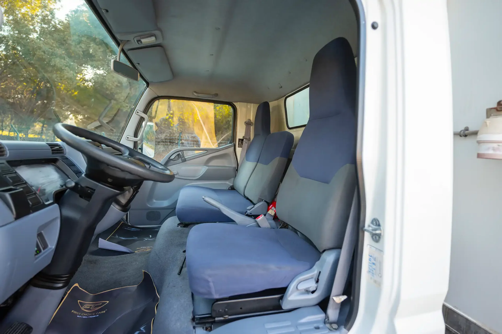 Used 2016 Mitsubishi Canter Freezer Box in White – Front Driver Side Cabin View for Sale at First Choice Cars Dubai Sharjah