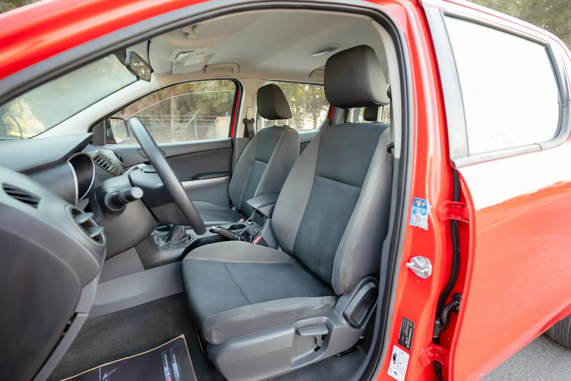 Used 2019 Mazda BT-50 XS in Red – Front Driver Side Cabin View for Sale at First Choice Cars Dubai Sharjah