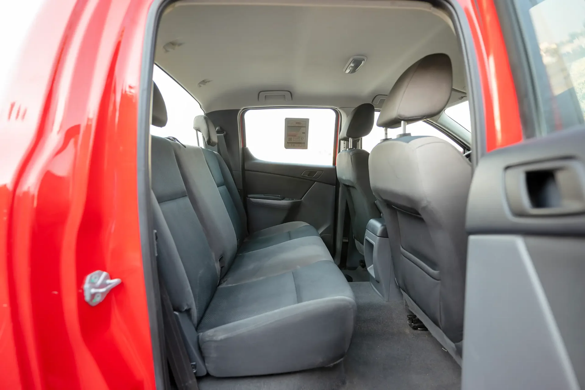 Used 2019 Mazda BT-50 XS in Red – Rear Passenger Side Cabin View for Sale at First Choice Cars Dubai Sharjah