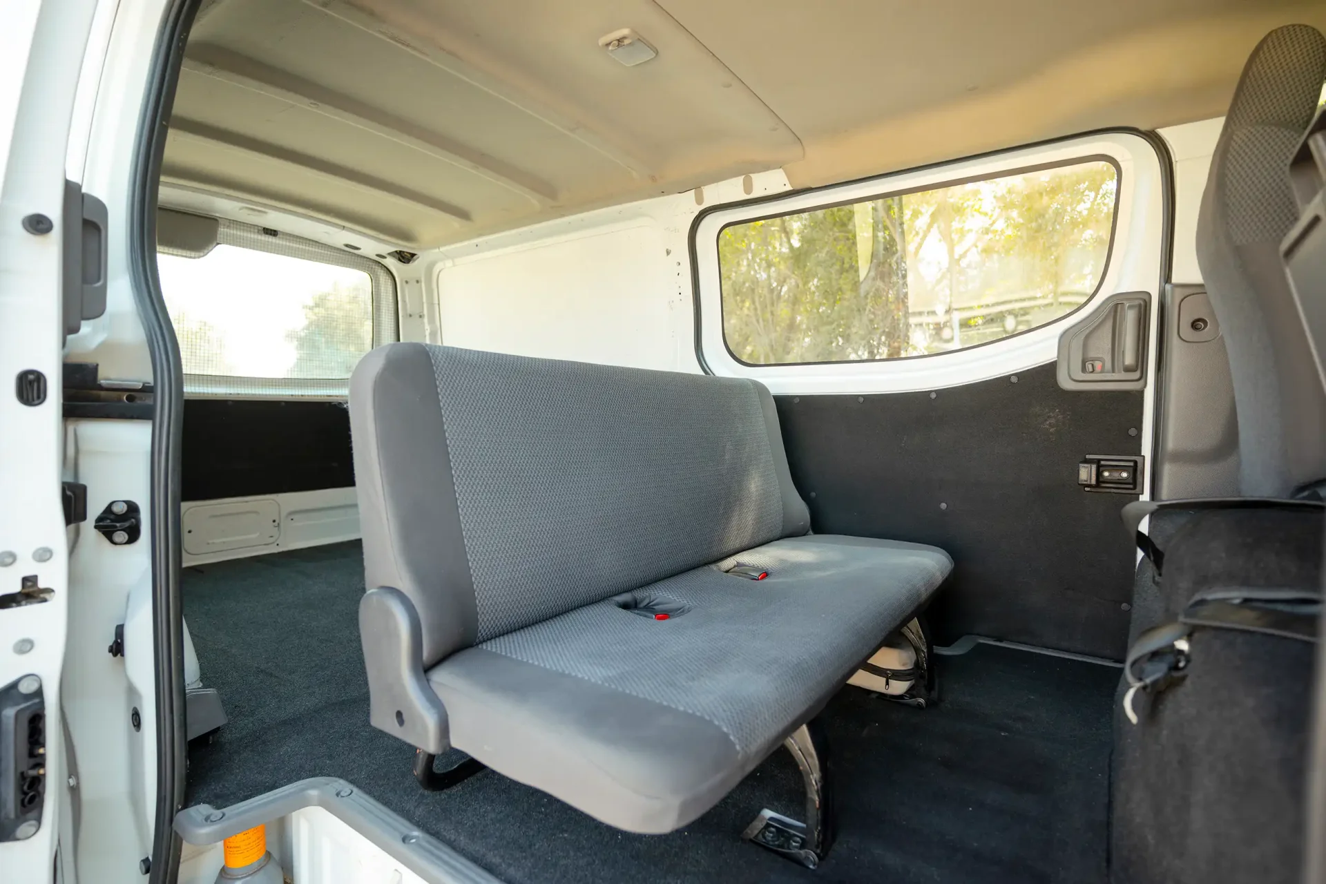 Used 2022 Nissan Urvan Standard Roof in White – Rear Passenger Side Cabin View for Sale at First Choice Cars Dubai Sharjah